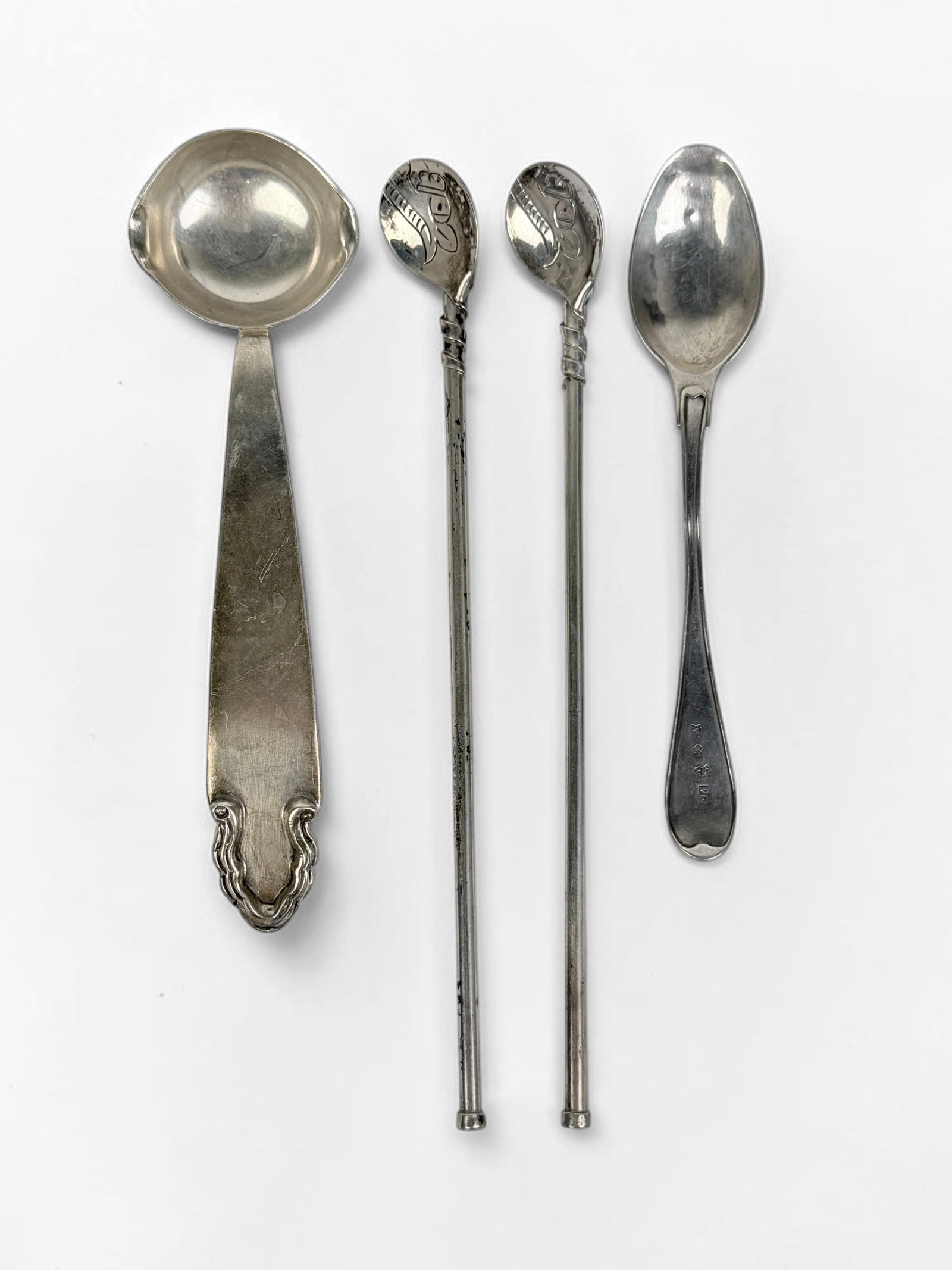 (4) Mexican Sterling Silver Spoons: Length: 7 1/2" Longest Spoon Total Weight: 2.45ozt Condition: Tarnishing and minor dents to the spoons. One spoon is monogrammed. See images for details. 