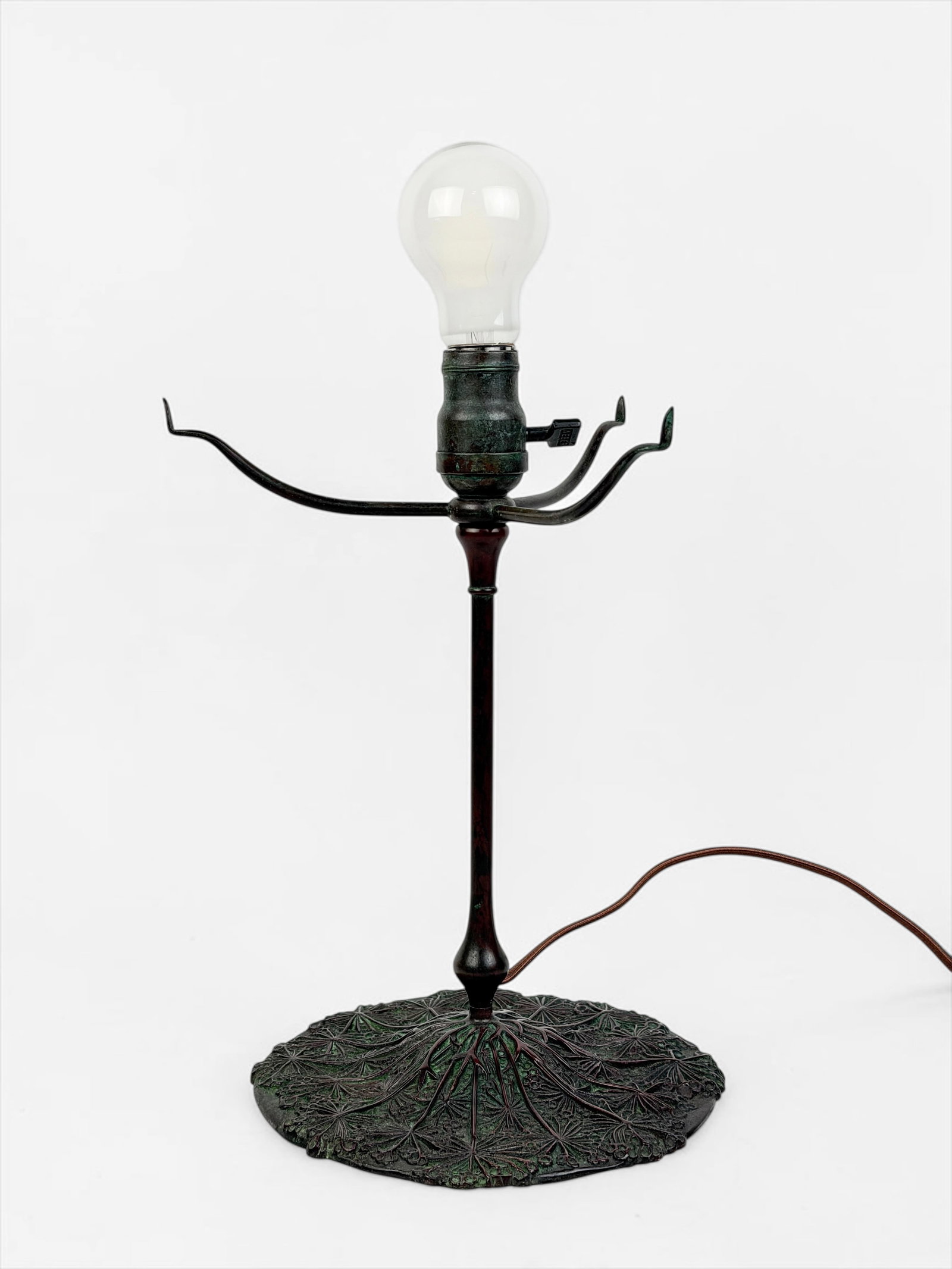 Tiffany Studios Queen Anne's Lace Bronze Lamp Base: No lamp shade included. Marked Tiffany Studios 325-3 on the base. Dimensions: 13" Tall x 8" Diameter Base Condition: The lamp has oxidation to the base, consistent with