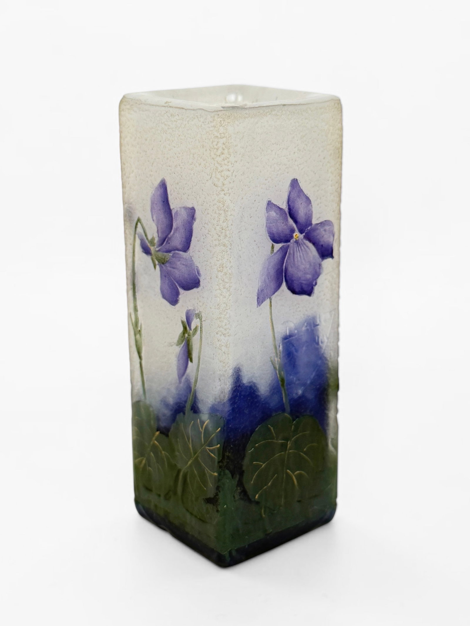 Daum Nancy "Violets" Cameo Vase: Signed by the artist. Dimensions: 3 3/4" x 1 1/4" x 1 1/4" Condition: There is a small indentation along the bottom edge, it is unclear if this is a chip to th