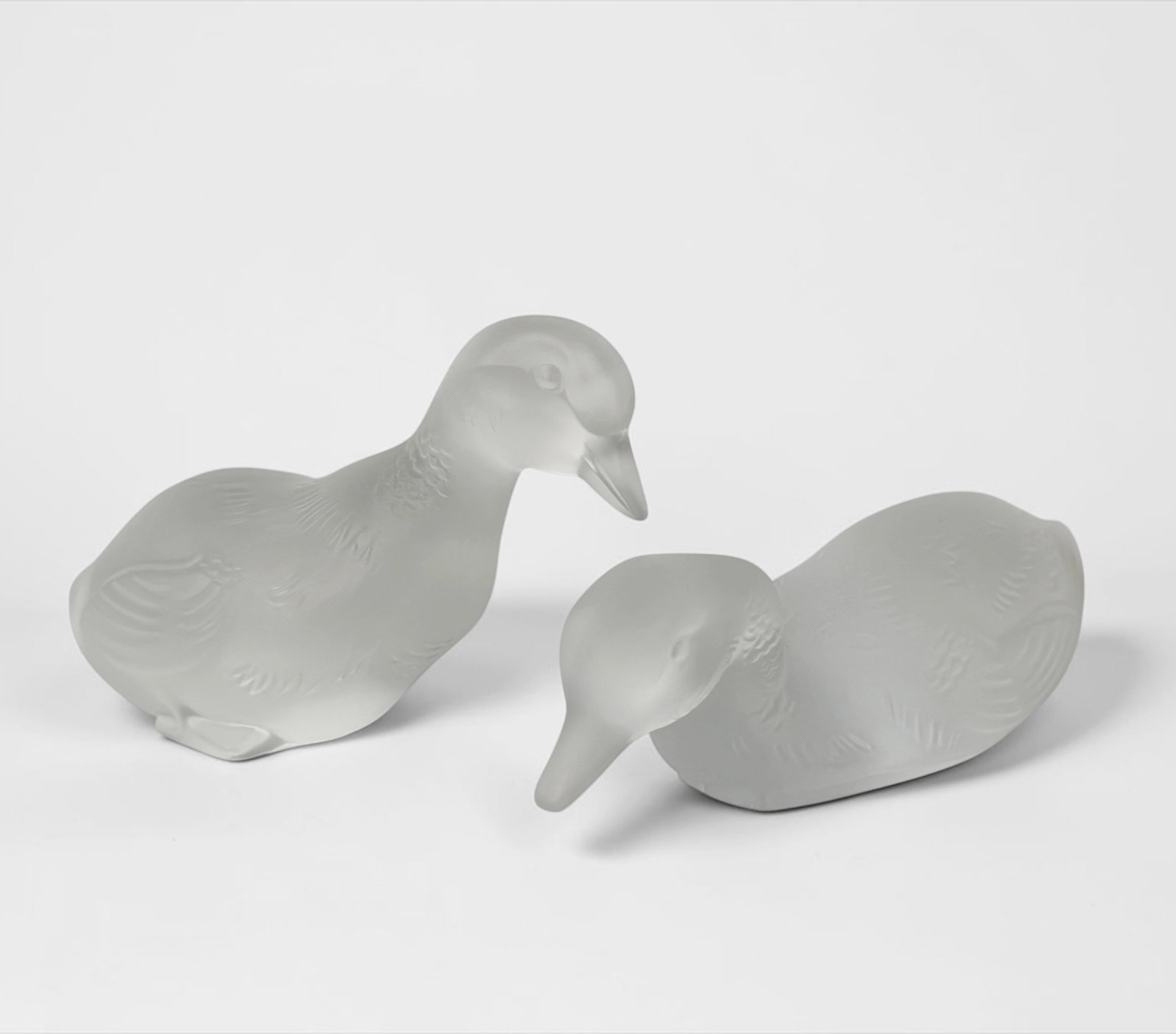 Pair of Baccarat Crystal Ducks: Marked as Baccarat on the bottom of both ducks. Dimensions: 3" x 4 1/2"; 1 3/4" x 5" Condition: Both ducks are in very good condition. About: