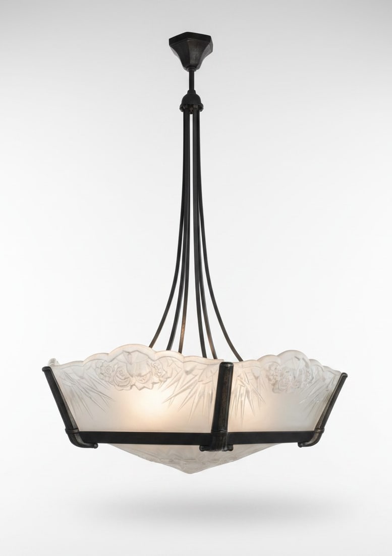 Early 20th Century French Art Deco Glass Chandelier: In the style of Daum Lorraine. Each glass panel is custom fitted to the frame, with the geometric stepped form characteristic of French Art Deco lighting of the period. Height: Approx. 40"