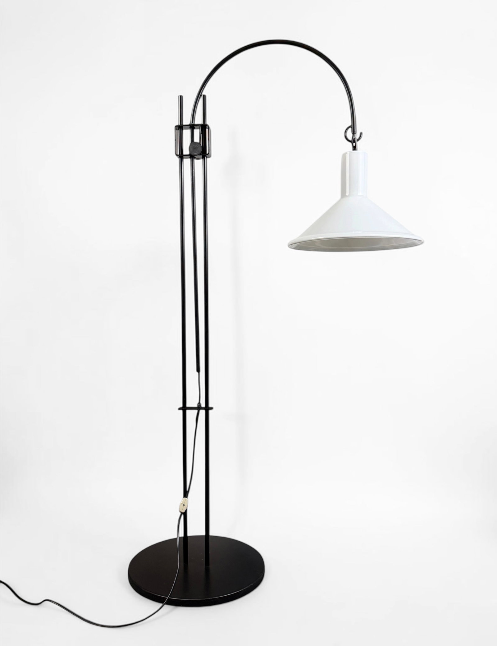 Michael Bang Holmegaard Mid Century Modern Floor Lamp: This lamp was designed by Michael Bang for Holmegaard in the 1970s. It features a black lacquered metal frame with an adjustable height and glass lamp shade. Dimensions: 61" Tall x 2
