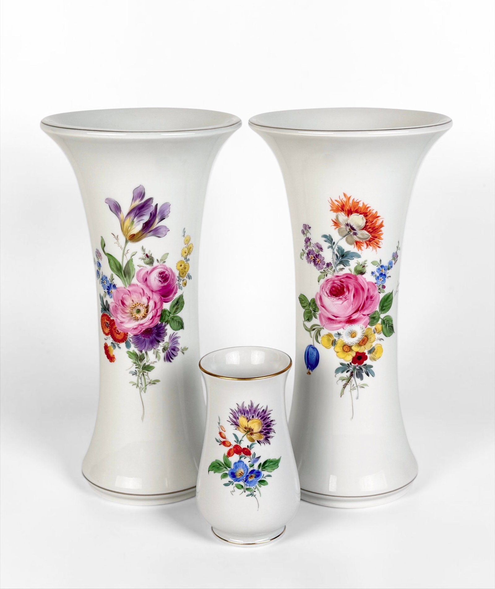 (3) Meissen Flower Motif Vases: Marked on the bottom of all vases. Dimensions: 9 1/2" Tall x 5" Diameter Larger Vases Condition: The vases are in very good condition. See images for details. 