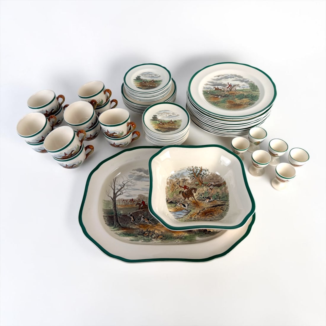 (60pc) Spode 'Fox Hunting' China Set: Lot Includes: (12) Tea Cups (6) Egg Cups (1) Serving Tray (1) Serving Bowl (12) Large Plates (8) Medium Plates (8) Small Plates (12) Tea Cup Saucers 