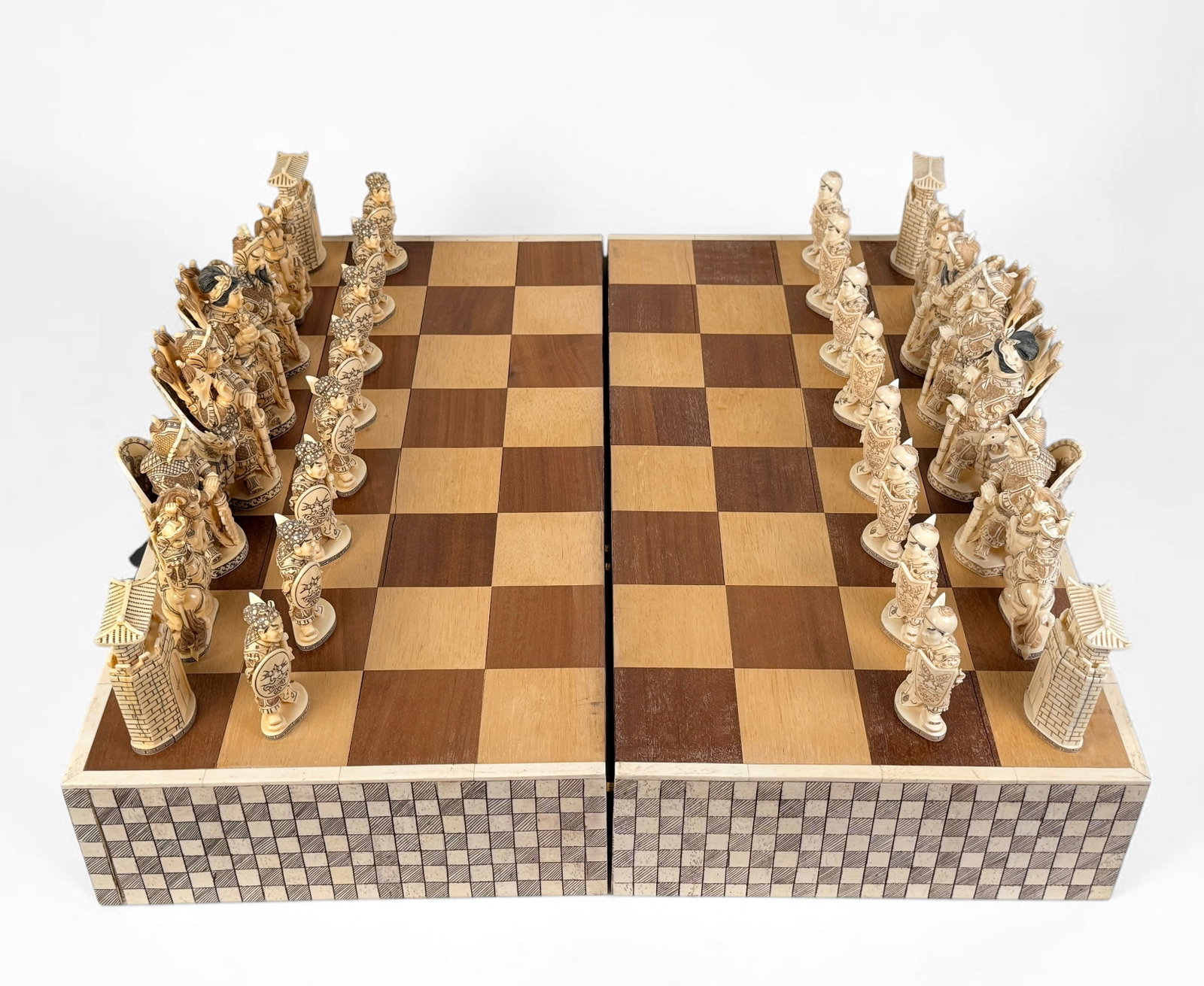 Chinese Carved Hippo Bone Chess Set: The pieces are stored within the chest that doubles as the playing board. Dimensions of Board (Unfolded): 26" x 26" x 5" Largest Piece: 6" Tall Cond