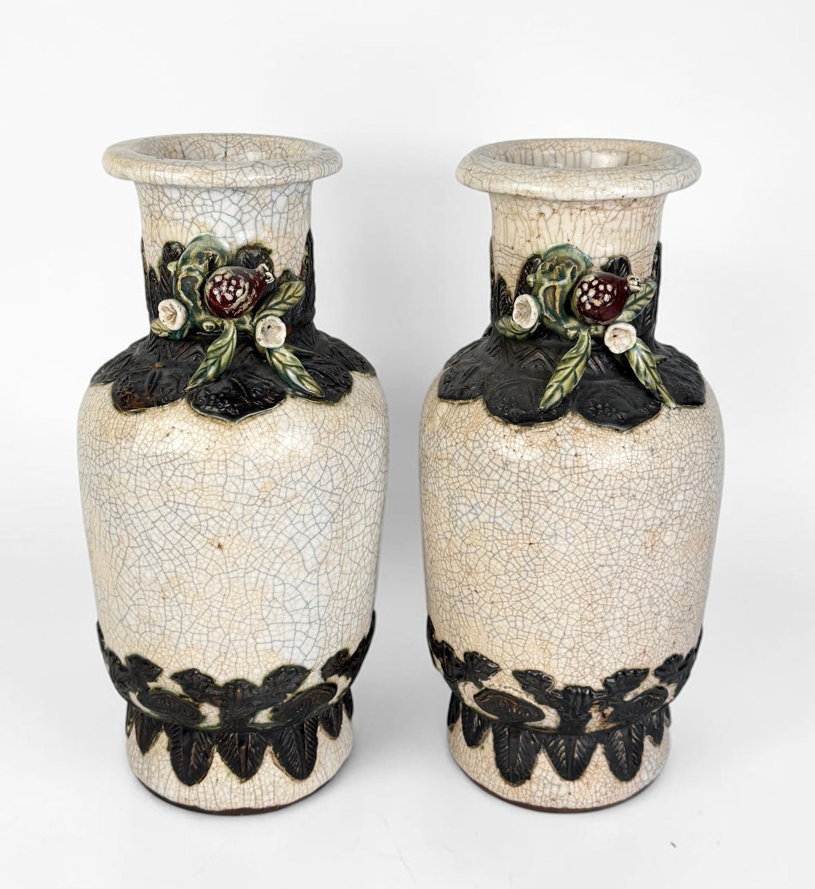 Pair of Chinese Crackle Glaze Vases: Maker's mark on the bottom of the vases. Dimensions: 18" Tall x 8" Widest Diameter Condition: Spots with loss of pigment and discoloration of the glaze. No cracks or 