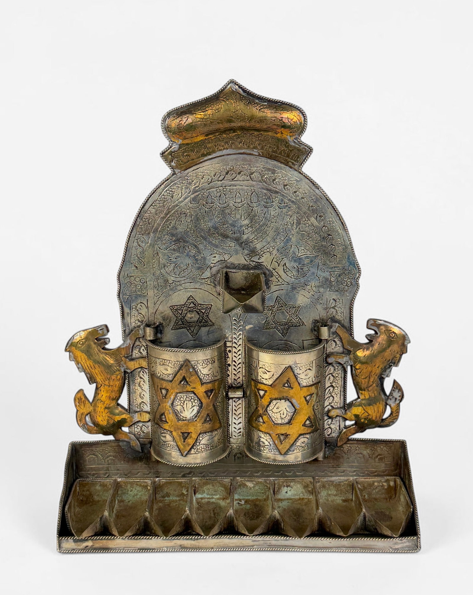 Handcrafted Moroccan Hanukkah Menorah: Dimensions: 11" x 9" x 3" Condition: Tarnishing and oxidation to the metal. Wear to the brass elements. Overall, the menorah is in good condition. 