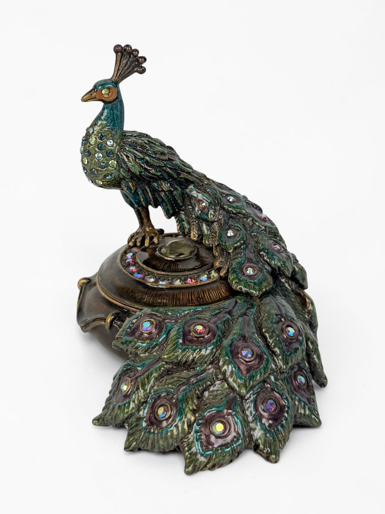 Jay Strongwater Peacock Charm Box: The box features detailed enameling and Swarovski crystal elements. Dimensions: 3" Tall x 3" Wide Condition: The box is in very good condition. 