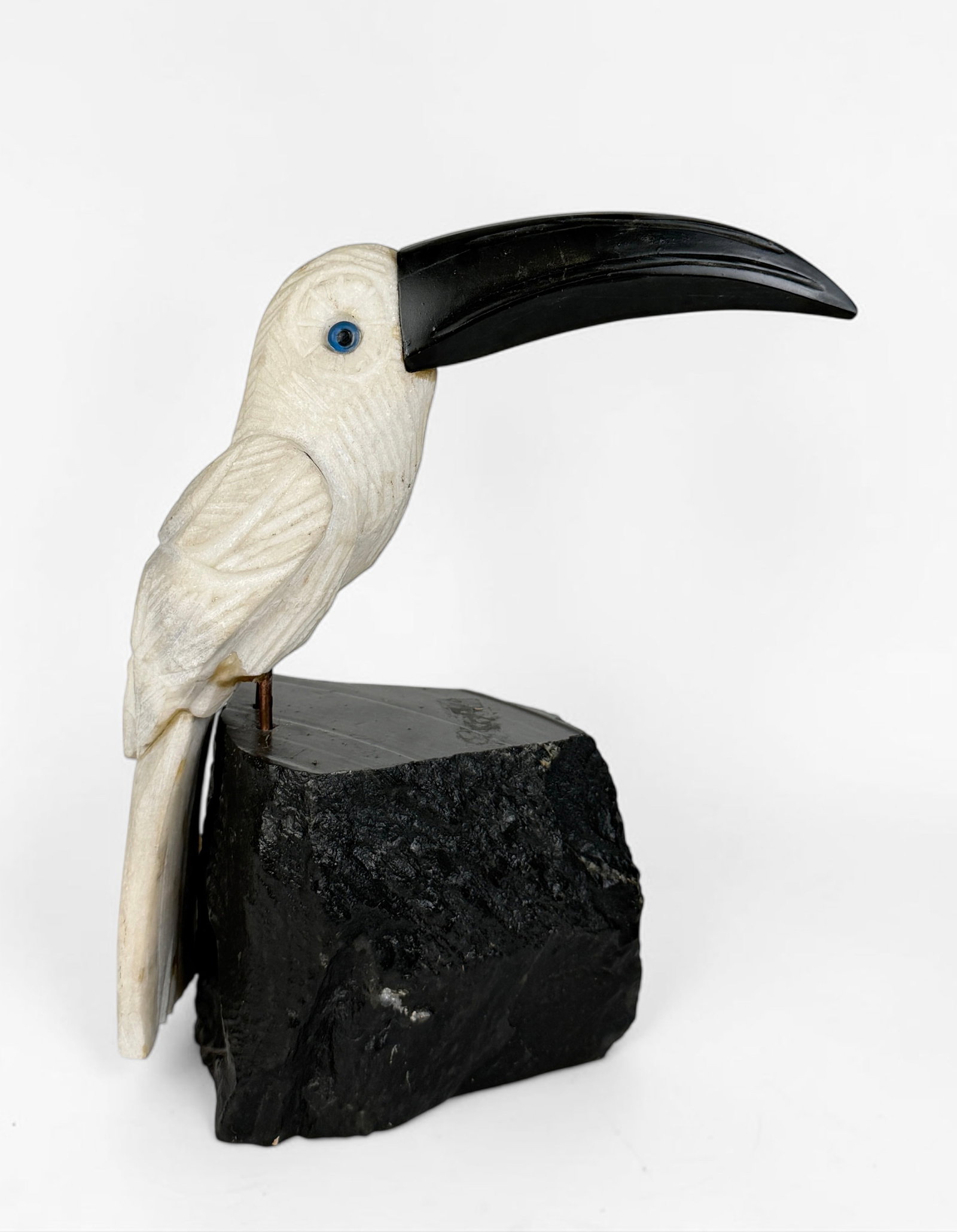 Vintage Carved Marble & Obsidian Toucan Sculpture: Dimensions: 9" x 8" x 3 1/2" Condition: Minor discoloration to the marble. Evidence of previous repair to the legs. Surface marks to the obsidian beak and base. 