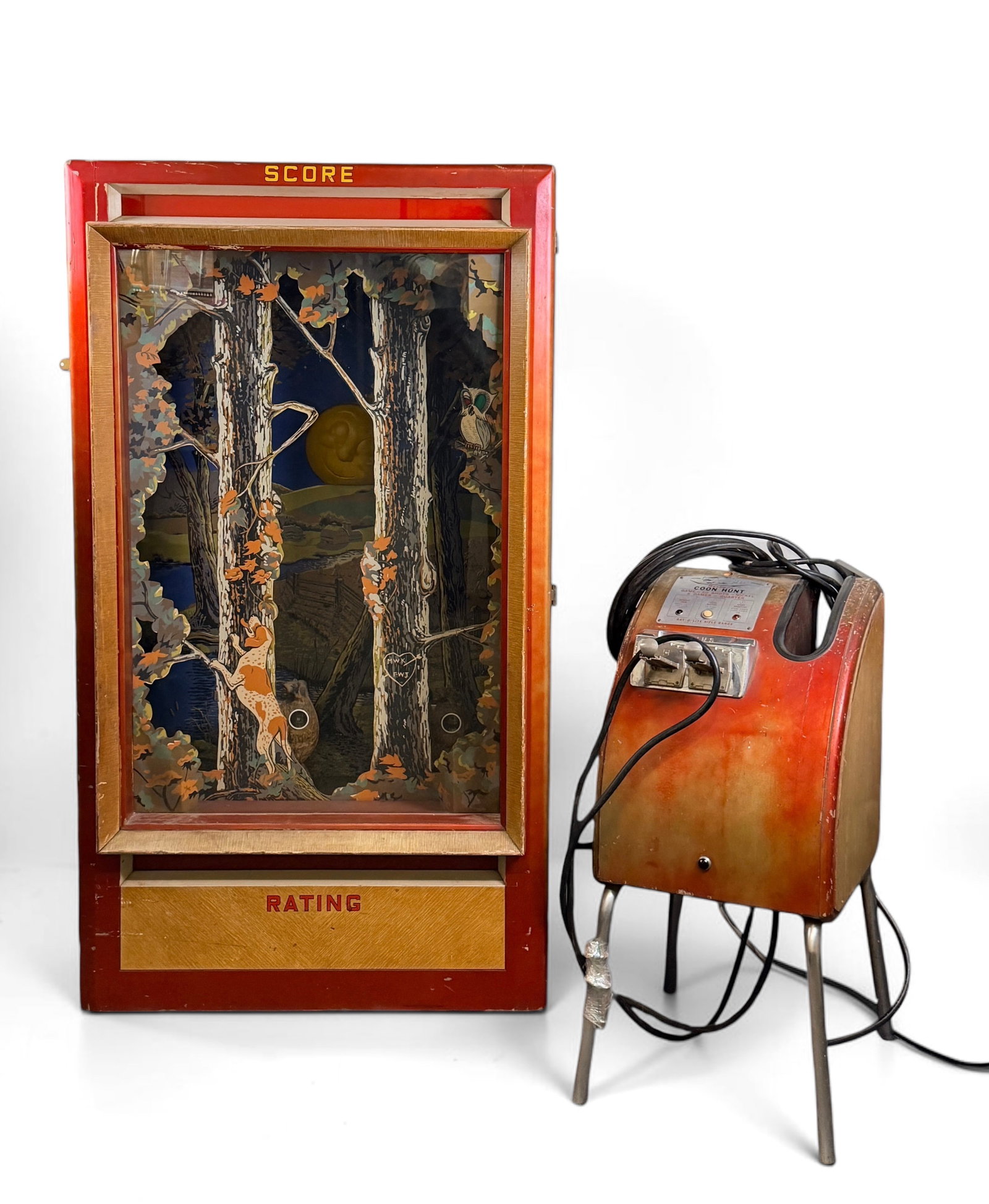 Vintage Seeburg "Coon Hunt" Light Gun Arcade Game: This game was produced in 1954. It features a reverse-painted glass scene of a forest where the object of the game is to shoot mechanical racoons with a ray-of-light rifle. Game Case: