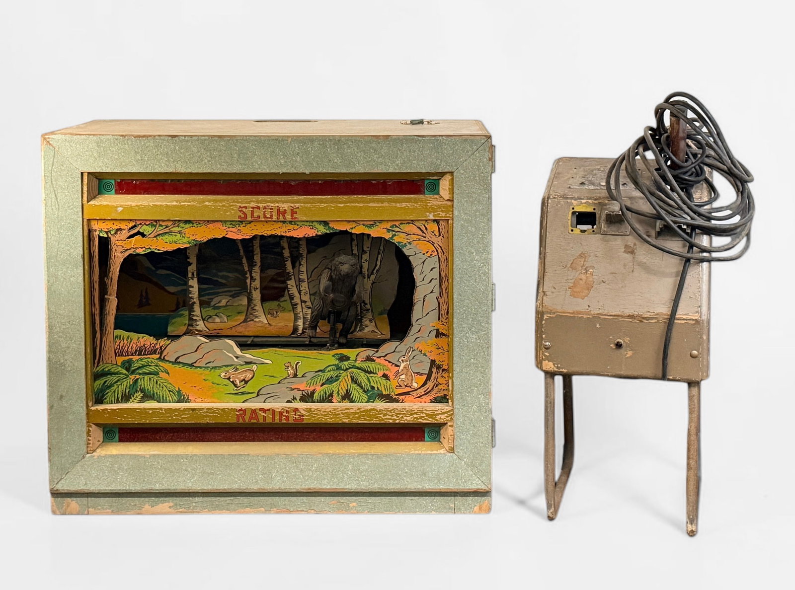 Seeburg "Shoot the Bear" Ray-O-Lite Arcade Rifle Game (A): Dimensions: 42" W x 36 1/2" T x 20" D Condition: Wear and loss of paint throughout the cabinet and gun stand. The front glass is missing. A set of keys is included. The elec