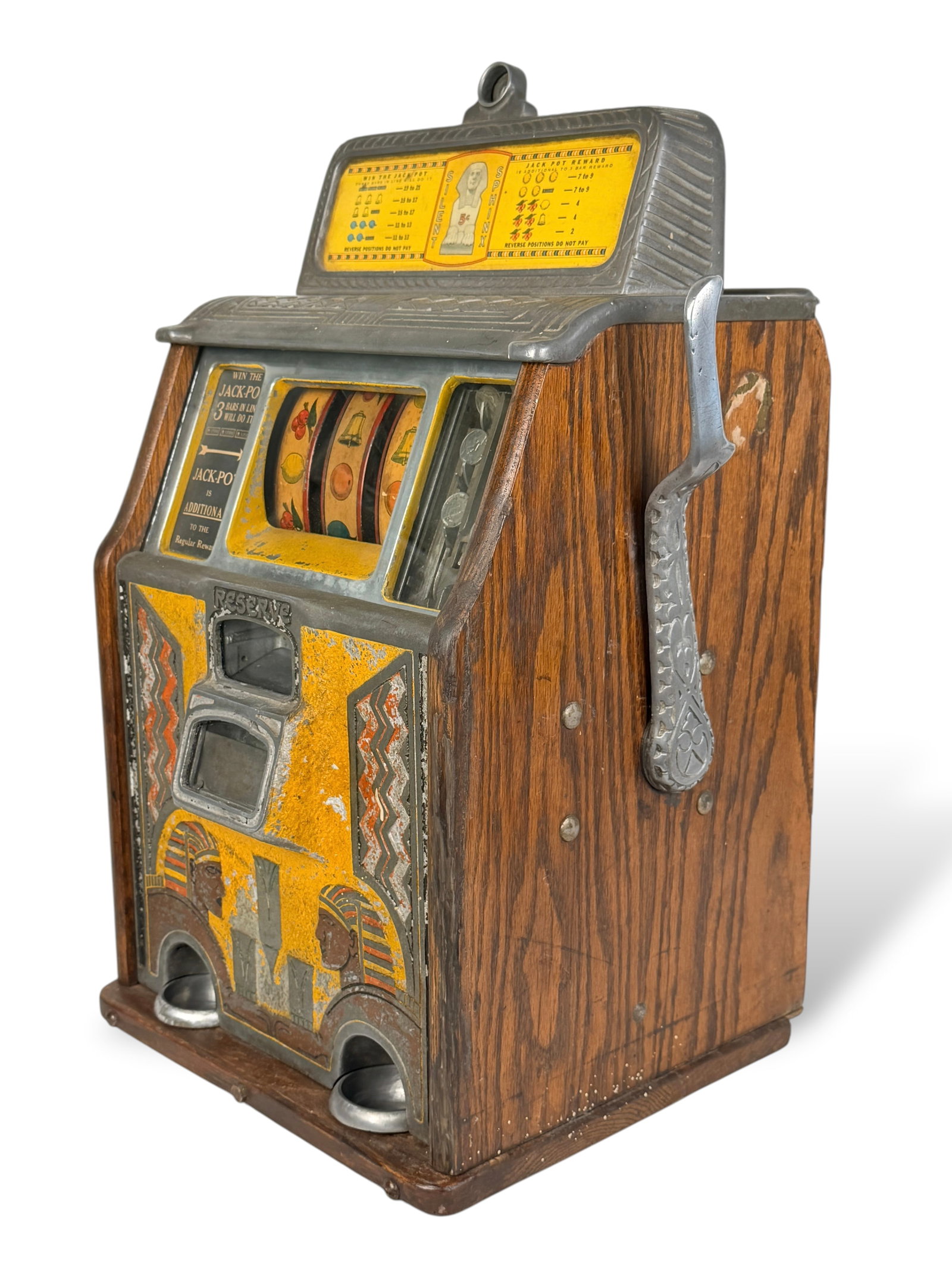 Antique Caille Silent Sphinx Slot Machine: Comes with the original manual booklet. Dimensions: 24" x 16" x 12 3/4" Condition: Wear throughout the machine, consistent with the item's age. A set of ke