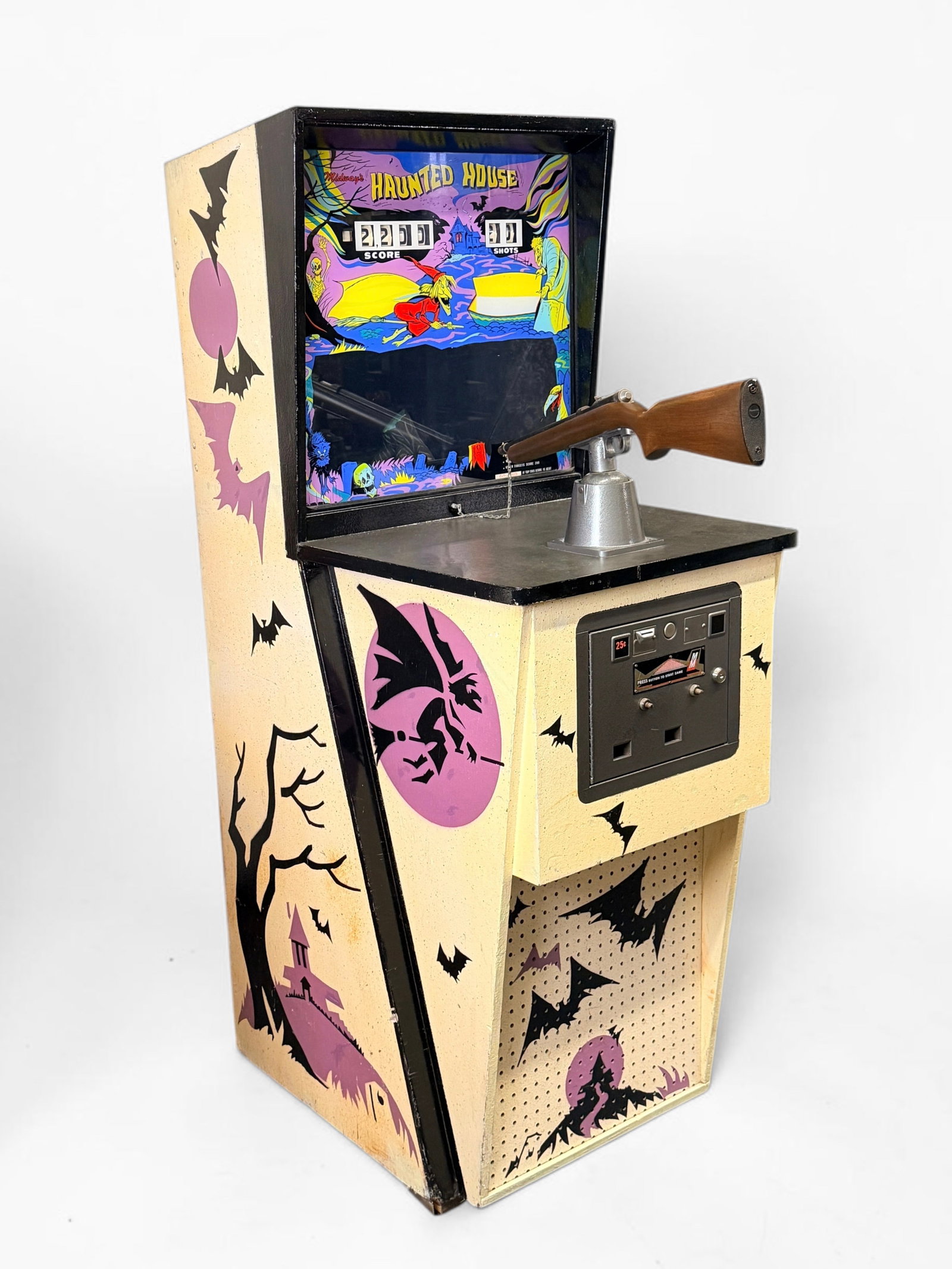 1972 Midway "Haunted House" Gallery Gun Arcade Game: Dimensions: 70 1/2" x 26" x 35" (gun controller not included in size) Condition: The game powers on and plays. Yellowing to the exterior paint, consistent with the age of th