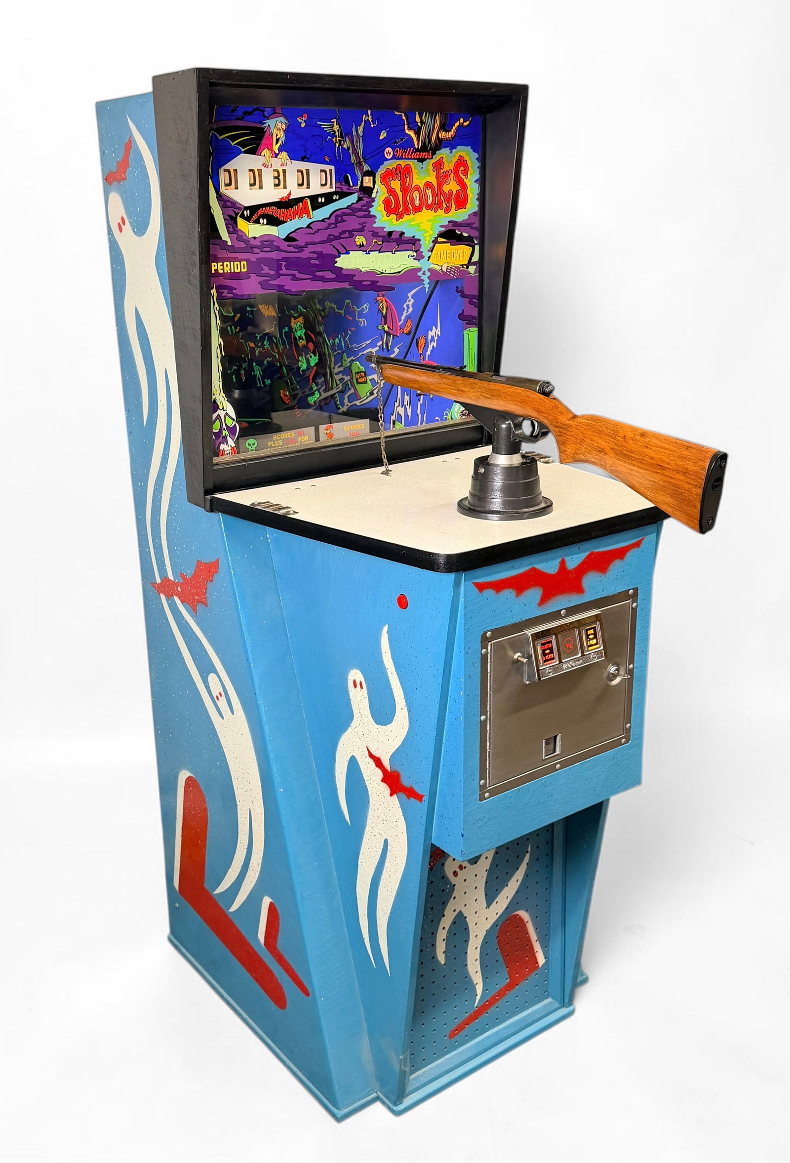 1969 Williams "Spooks" Upright Gallery Gun Arcade Game: Dimensions: 69" x 26" x 35" (gun not included in size) Condition: The machine powers on and plays. Aging to the exterior paint, consistent with the machine's age but overall