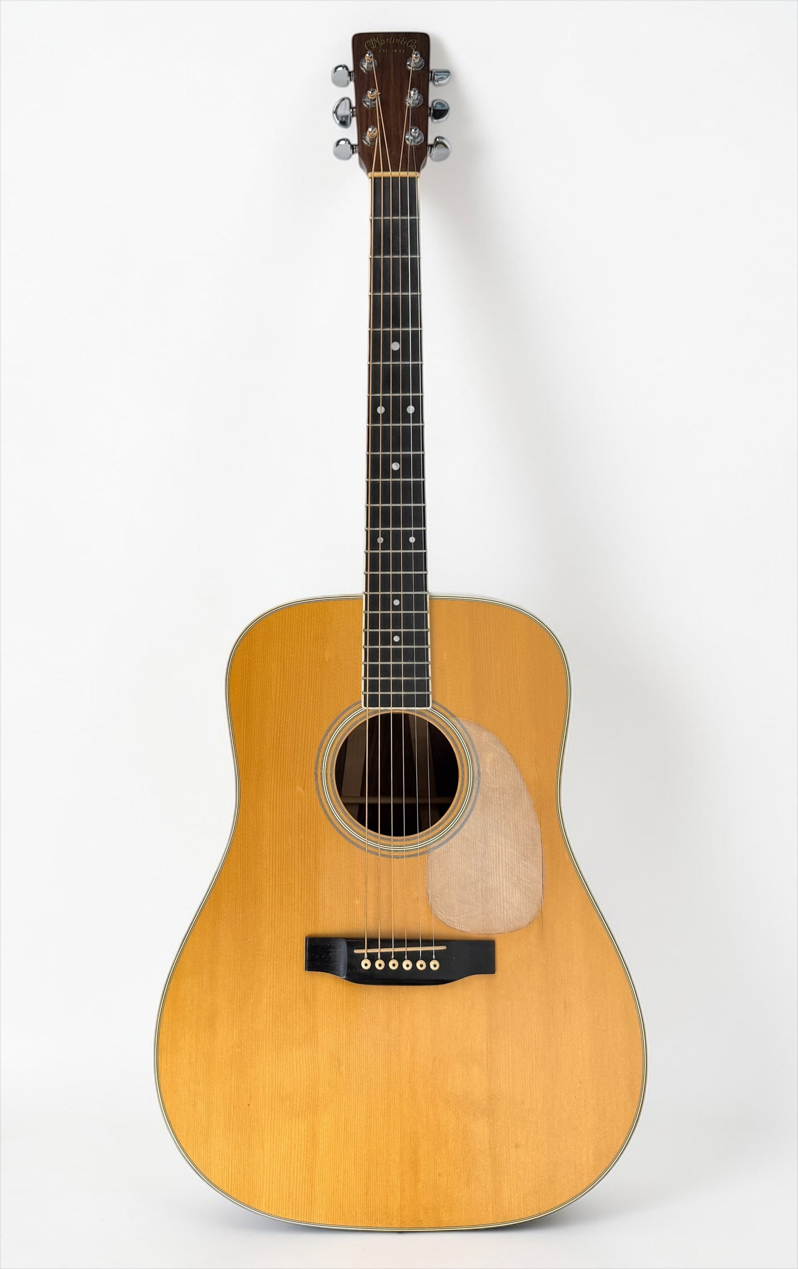 1977 Martin D-35 Acoustic Guitar: Color: Natural Finish Body: 3-piece back design and spruce top Serial Number: 391322 Case: Original Martin Hard Case Dimensions: Guitar: 41" x 15 1/2" x 4" Case: 43 1/2" x 1