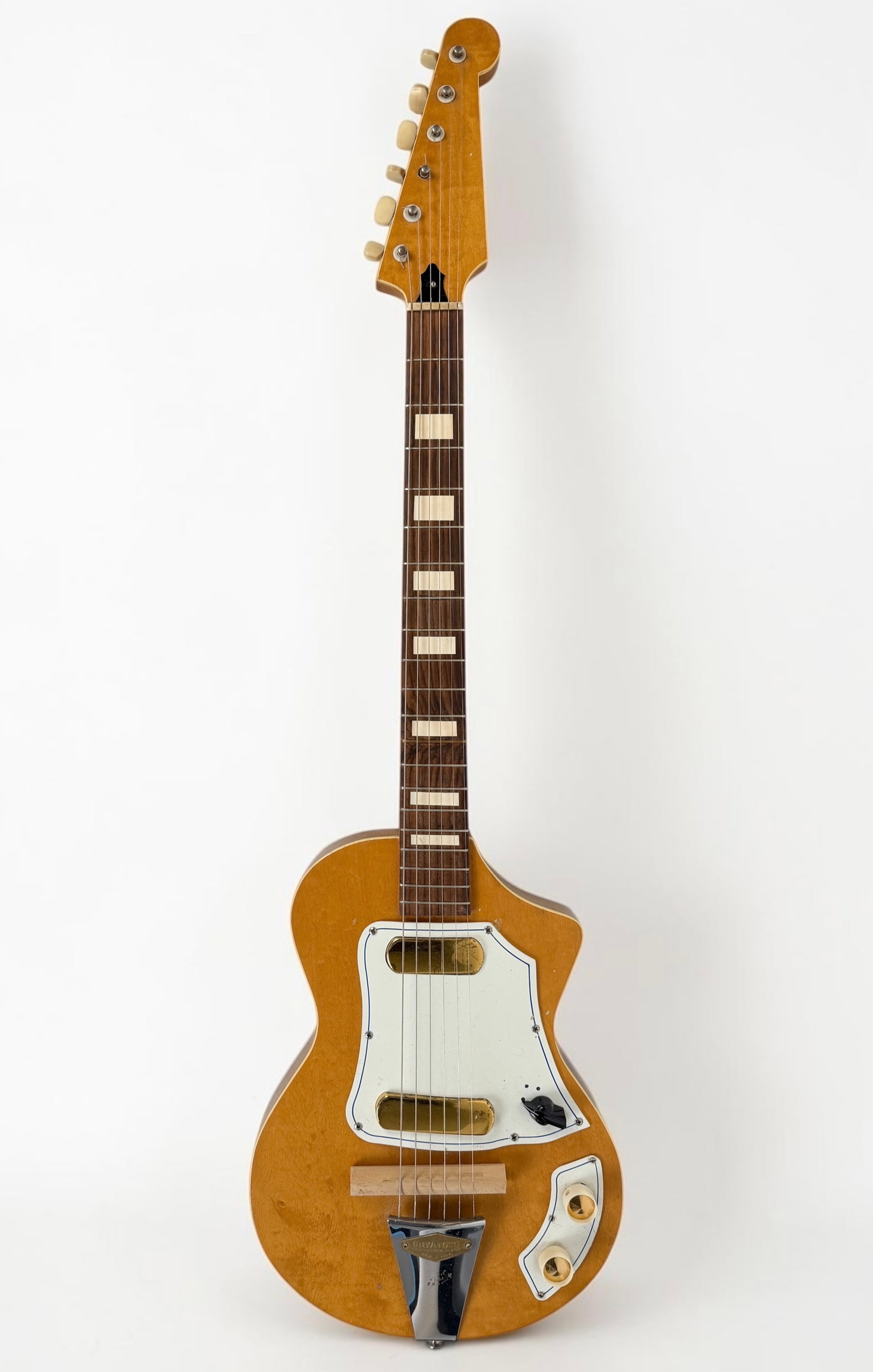 Vintage Guyatone LG-50 "Feather" Electric Guitar: Manufactured in Japan in the late 1950s. Guitar Length: 38 1/2" Condition: Light wear to the surface and spots of green pigment to the body. There is a small hole n