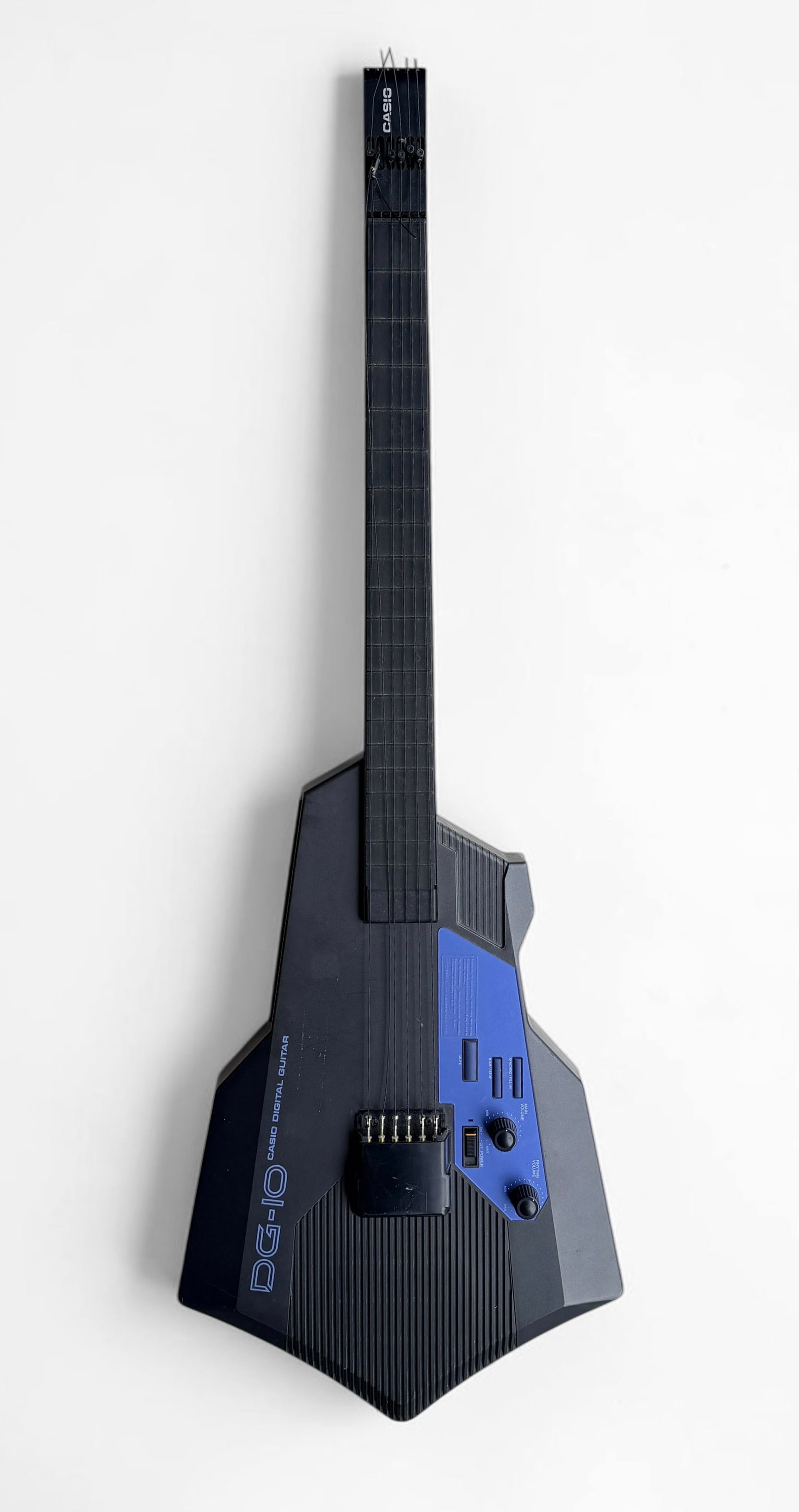 1980s Casio DG-10 Digital Guitar Synthesizer: A case is not included. Serial Number: N/A Length: 39" Condition: At least one string needs replacement and repair, but all should be inspected. Surface scratches throughout the body. The gui