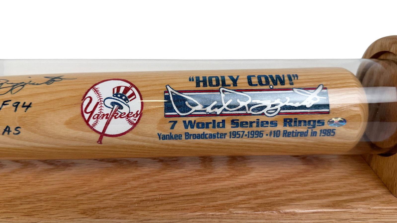 Signed Phil Rizzuto "Holy Cow!" Cooperstown Bat: The bat is in a protective case and features his 1950 AL MVP award and 1951 World Series MVP title. Limited Edition. Length: 33 1/2" Condition: The bat is in very good condition. Signature an