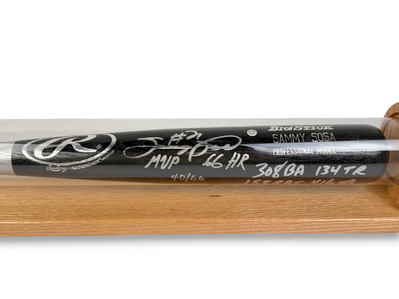 Signed Sammy Sosa Rawlings Big Stick Bat: The bat is in a protective case and features his player statistics. Limited Edition: 40/66 Length: 33 1/2" Condition: The bat is in very good condition. The signature and inscriptions are b