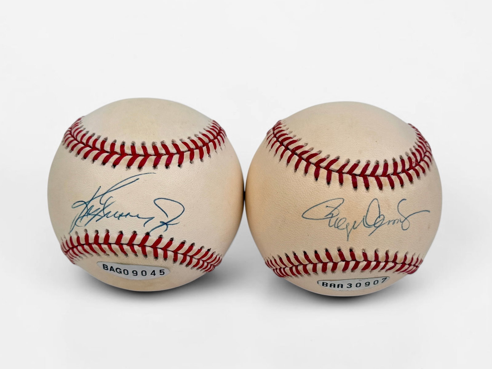 (2) Ken Griffey Jr & Roger Clemens Signed Baseballs: One ball is an official American League ball and one is an official Major League ball. Size: Approx. 3" Diameter Condition: Minor yellowing to the baseballs. The signatures ar