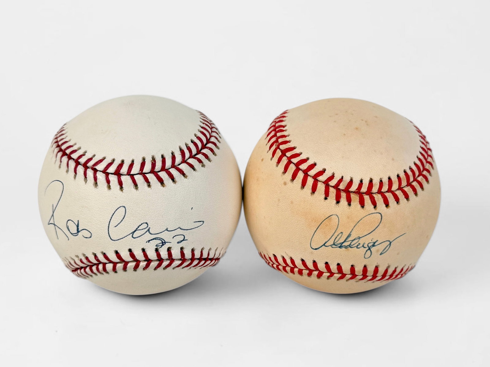 (2) Signed Alex Rodriguez & Robinson Cano Baseballs (B): Signed by Alex Rodriguez and Robinson Cano. Both balls come in display cases. Dimensions: Approx. 3" Diameter Condition: Aging and yellowing to the leather of the ball