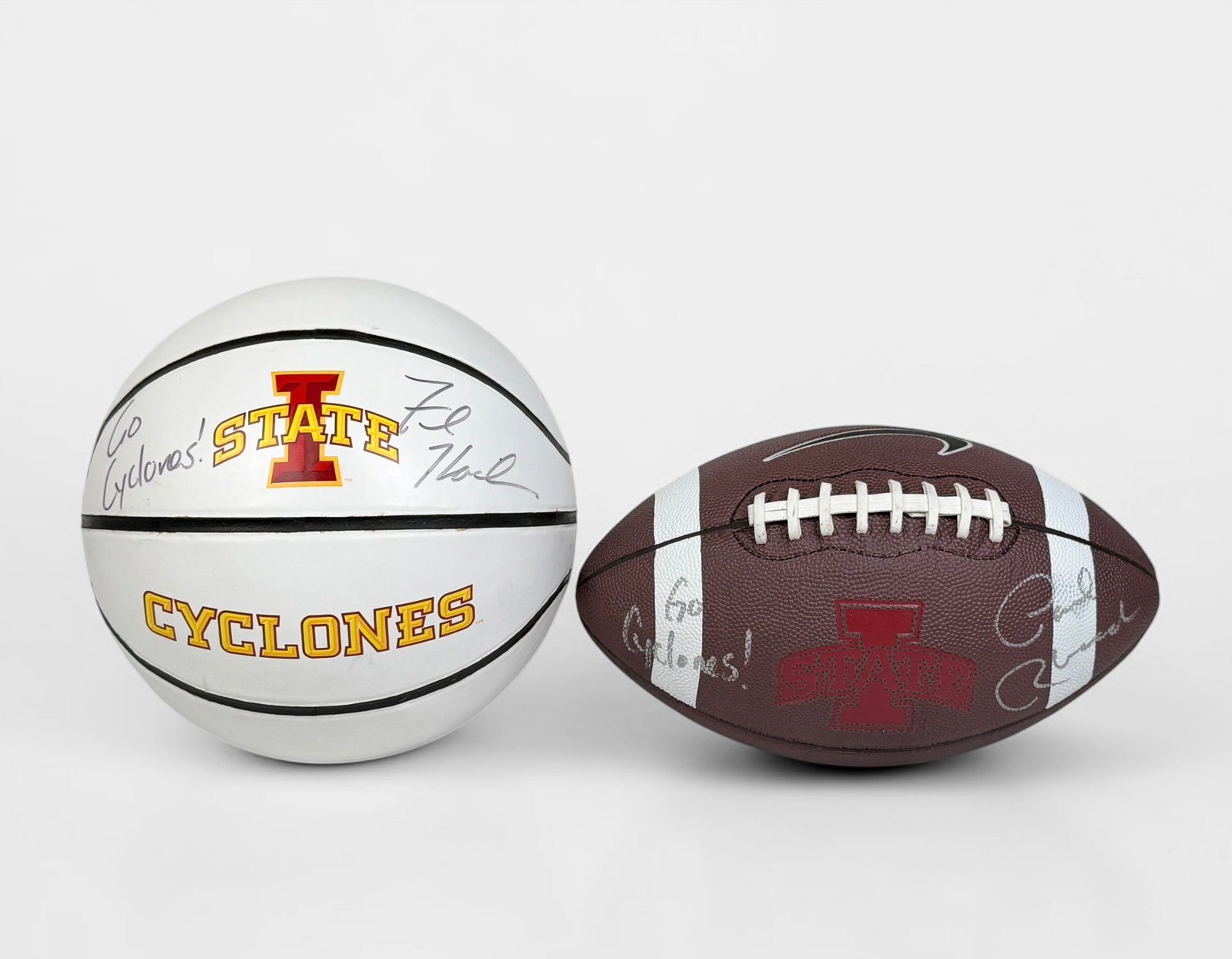 Signed Iowa State University Football and Basketball: The basketball is signed by Fred Hoiberg. Comes with the marker used for the signature. Comes in display case. The football is signed illegibly. Comes in display case. Condition: