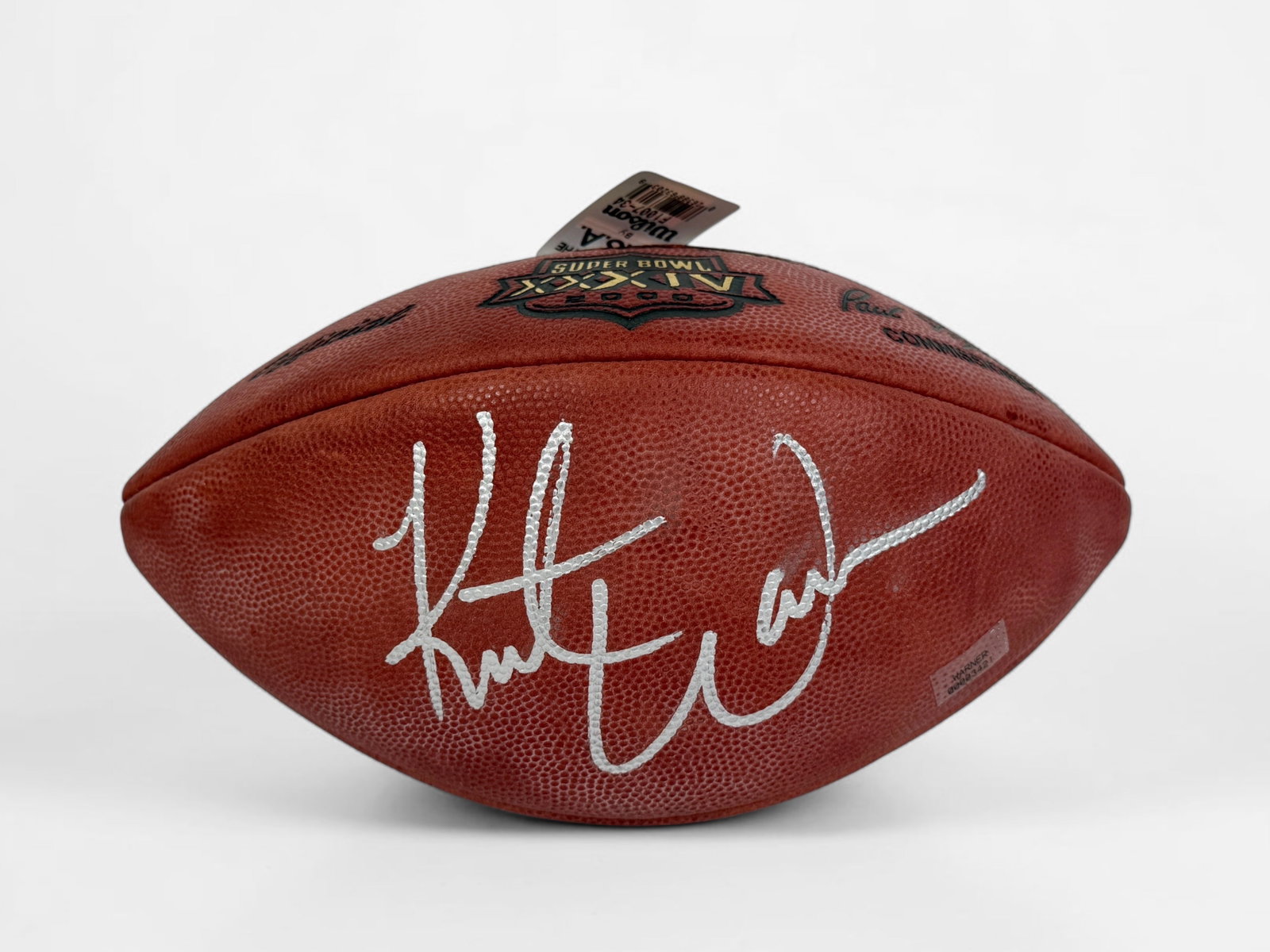 Signed Kurt Warner NFL Super Bowl XXXIV Wilson Football: The football comes in a display. Certificate of Authenticity included. Length: About 10 1/2" Condition: The football has some minor aging and is slightly