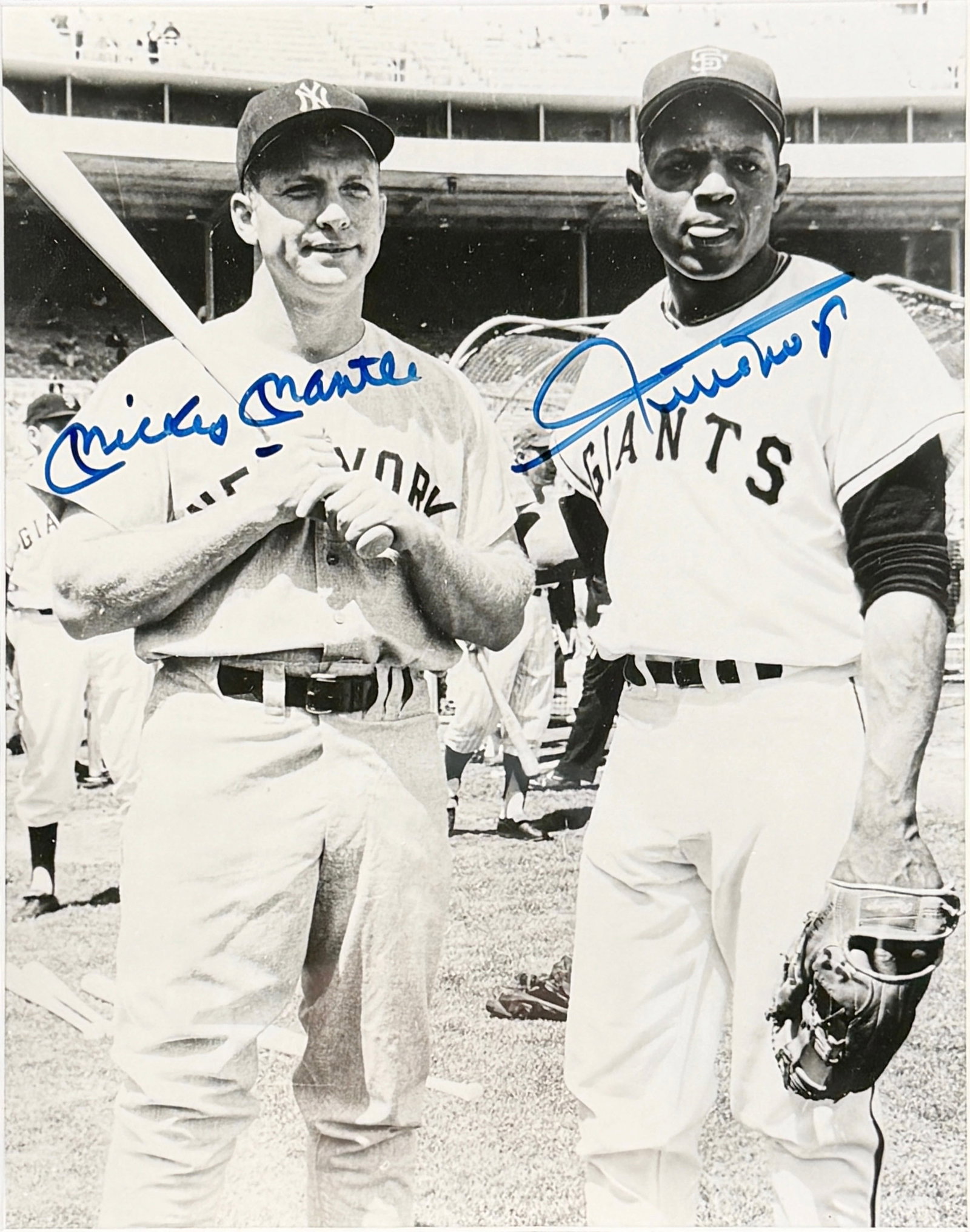 Signed Mickey Mantle & Willie Mays Photograph JSA Cert: Comes with a ceritificate of authenticity. Image: 9 1/4" x 7 1/4" Frame: 16" x 14" Condition: The photograph is in good condition. The glass has