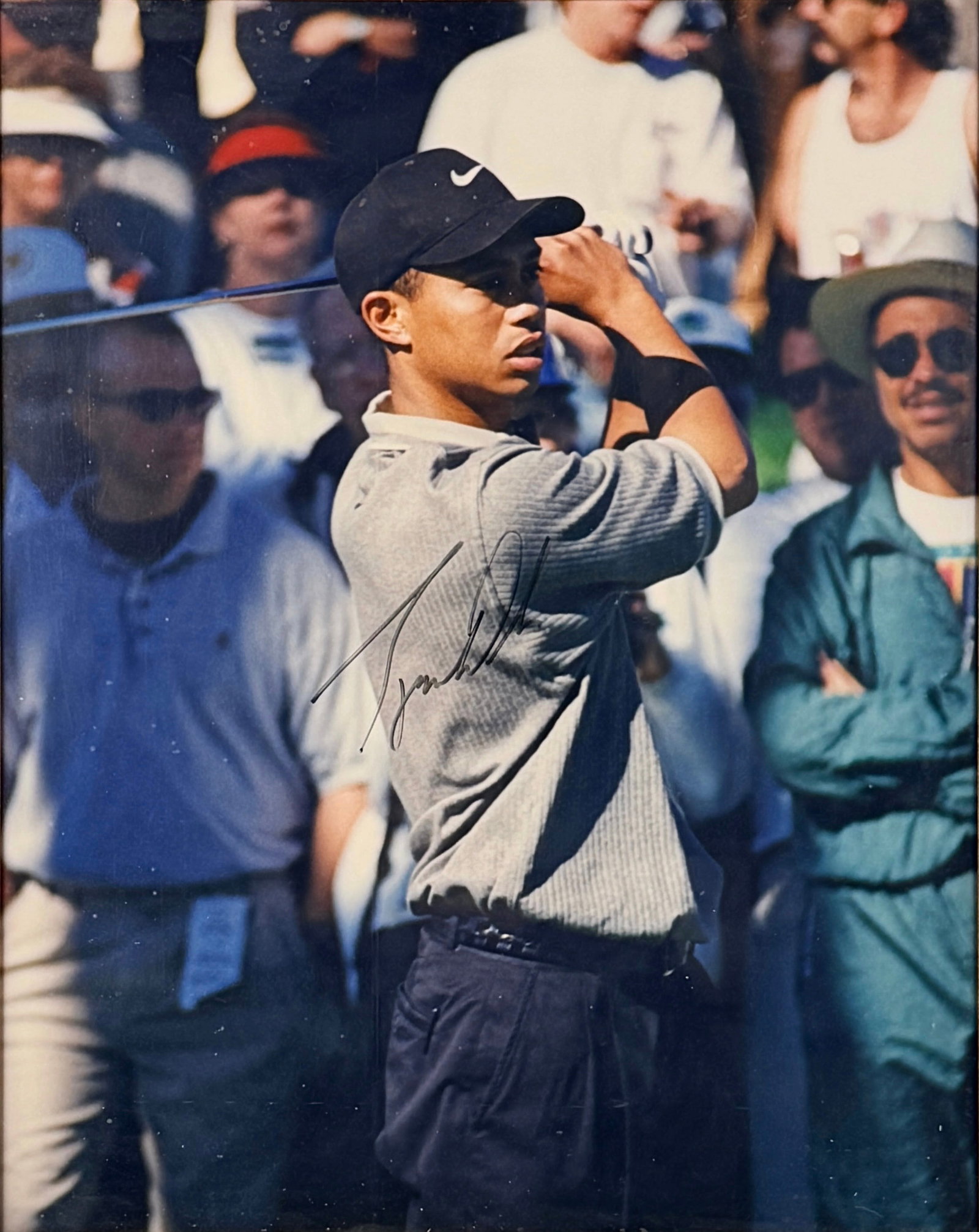 Signed Tiger Woods Photograph: Certificate of Authenticity Included Image: 19 1/2" x 15 1/2" Frame: 22 1/2" x 18 1/2" Condition: The photograph is in good condition. Minor marks