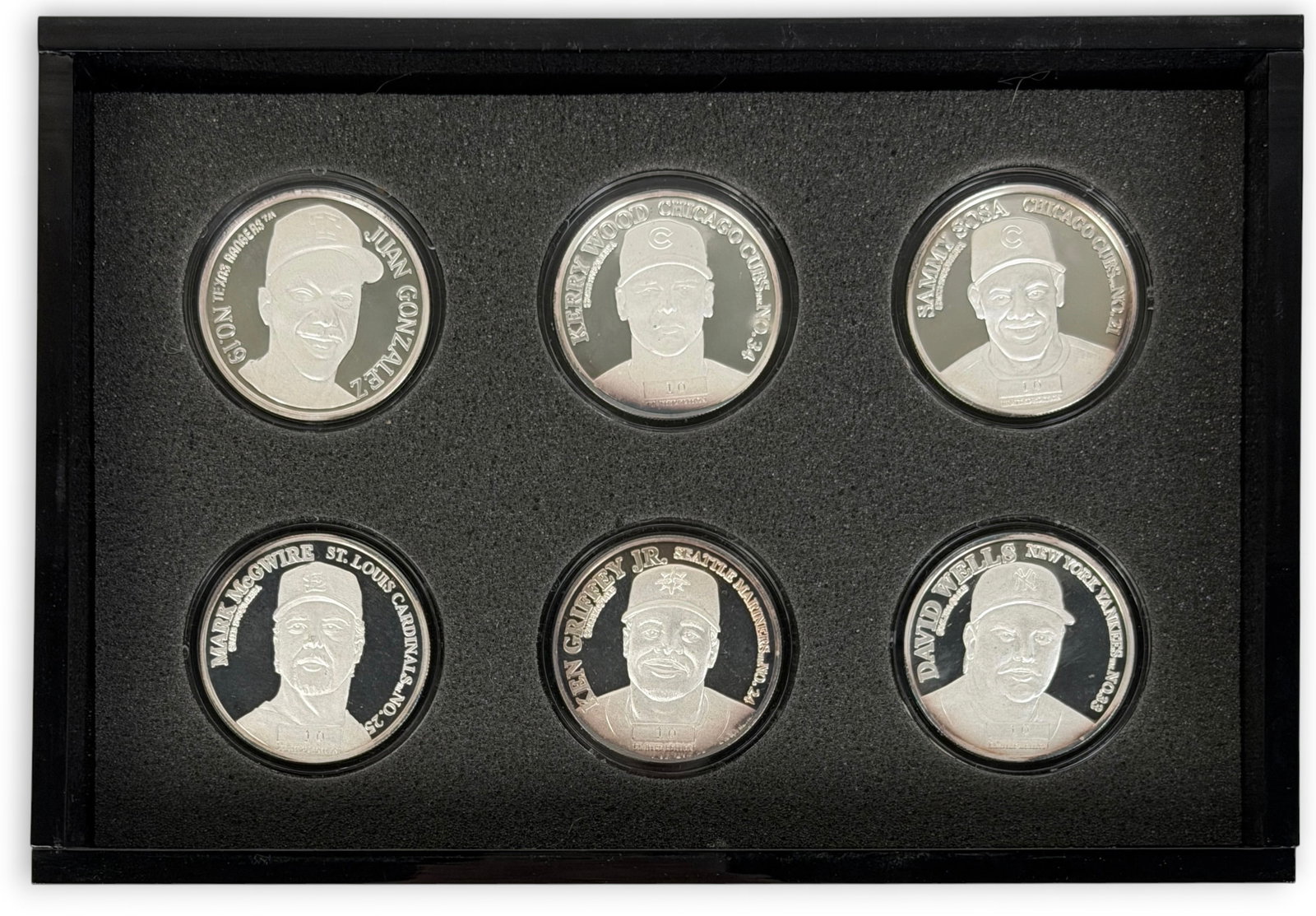(6) .999 Silver MLB 1ozt Coins: The set contains 6 coins featuring various MLB stars. Coins come in a display case. Condition: The coins have minor tarnishing. The case has surface scratches. 