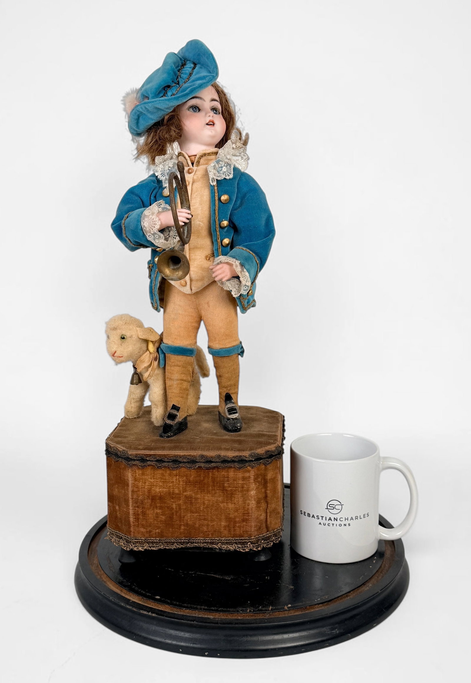 Leopold Lambert & Jumeau "Boy Playing Horn" Musical Automaton: Comes with a glass dome. Height: 20 1/2" Condition: Dolls wind up and play music while moving. Wear to the clothing and hair. Please see photos.