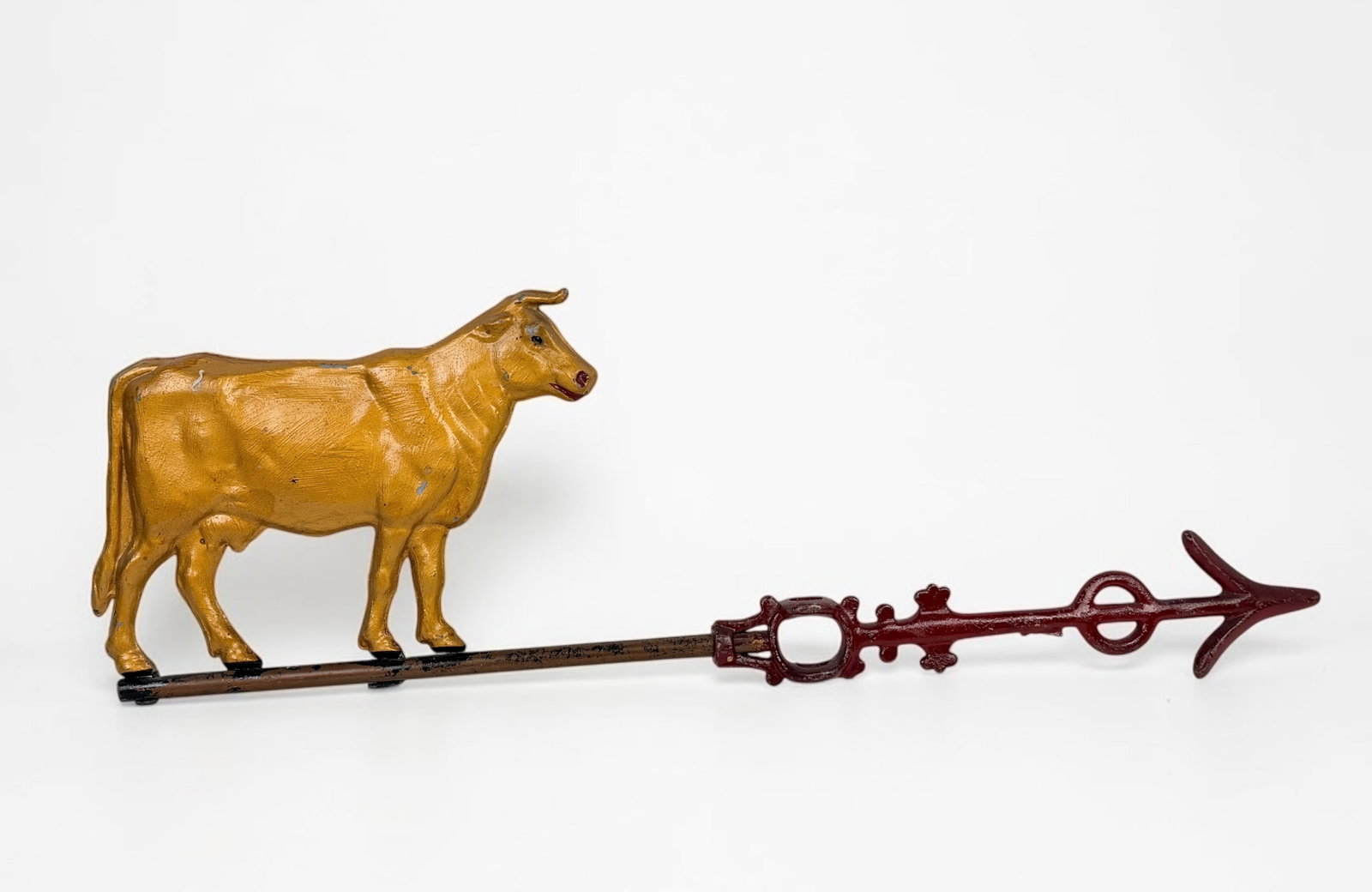 Antique Cow Weathervane: Dimensions: 8 1/2" x 27 1/2" Condition: The cow has been repainted. Loss of paint throughout and rust on the cast iron. 