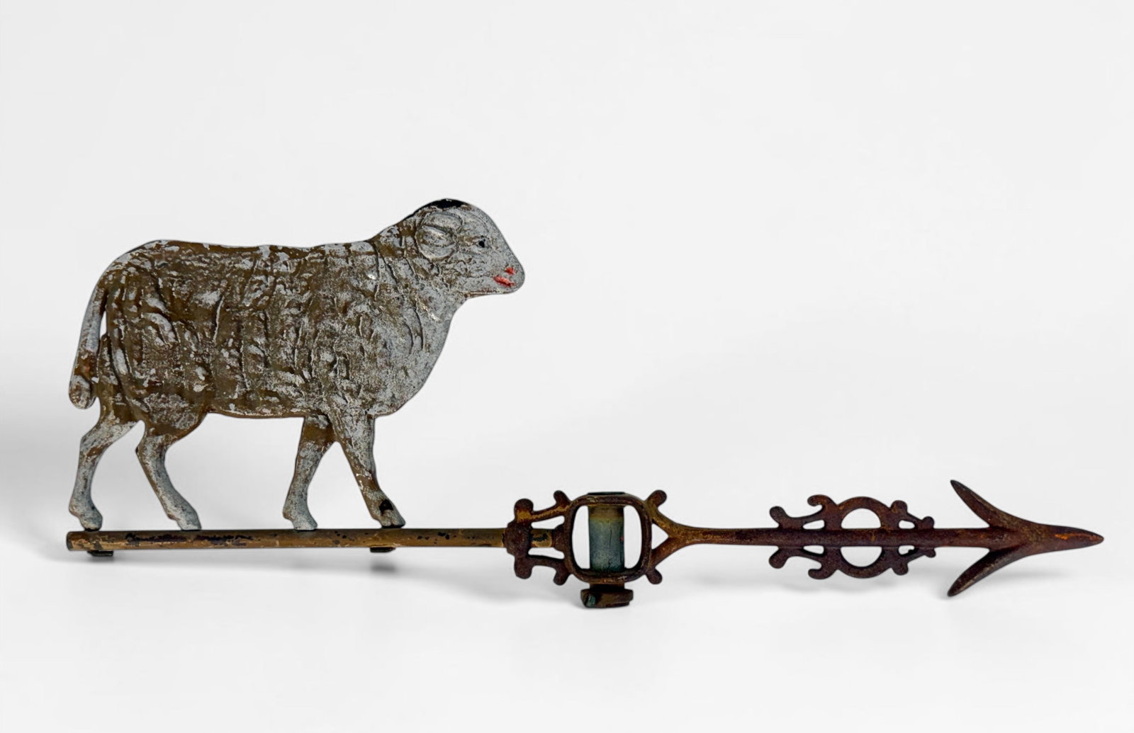 Antique Sheep Weathervane: Dimensions: 7" x 21" Condition: Significant wear to the silver paint on the sheep and rust on the arrow.