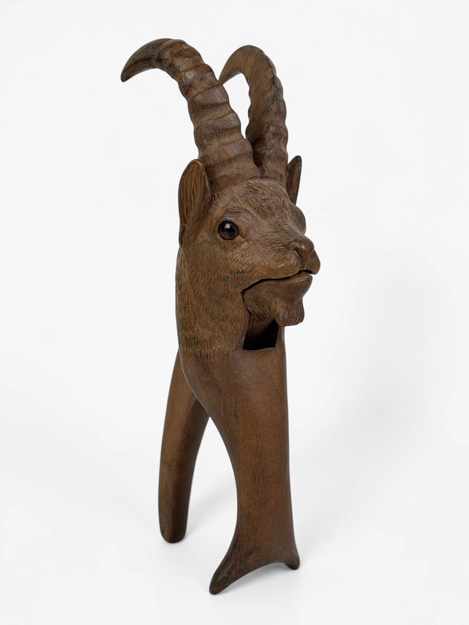 Black Forest Nutcracker with Goat Figure: Dimensions: 9" Tall x 2 1/2" Wide x 3" Deep Condition: Minor marks to the wood; overall in good condition. 