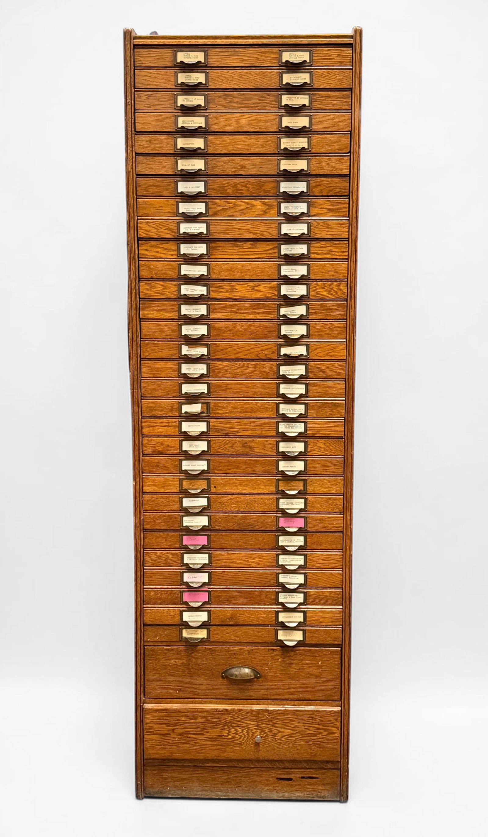 Vintage Multi-Drawer Oak File Cabinet: Dimensions: 74" x 21 1/4" x 17" Condition: Scratches to the wood around the exterior. Tarnishing to the brass drawer handles from consistent touch and use. The bottom 