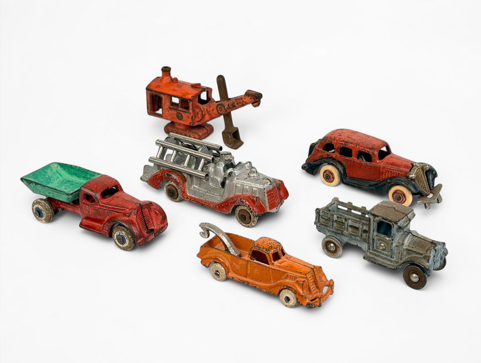 (6) Antique Cast Iron Toy Cars (D): Includes brands such as Hubley and Arcade Manufactoring Co. Dimensions of Largest: 2 3/4" x 4 1/2" x 1 1/2" Condition: Rust throughout the toy cars, with some loss o