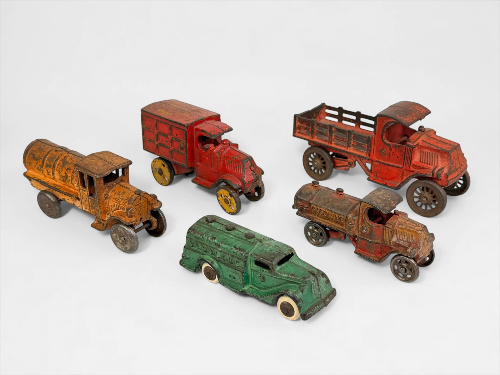 (5) Antique Cast Iron Toy Cars (F): Includes brands Kenton Hardware Company, A.C. Williams, and more. Dimensions of Largest: 3 1/2" x 6 1/2" x 2 1/2" Condition: Rust and loss of pigment throughou