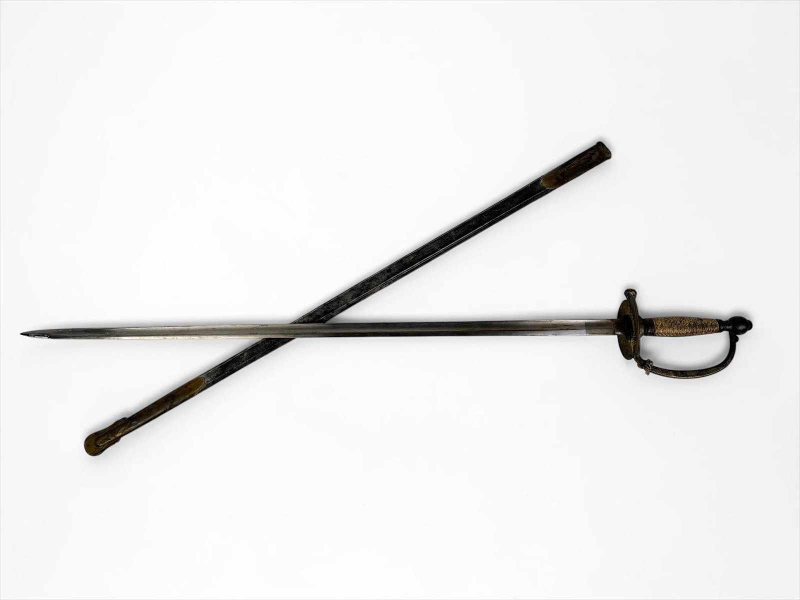 Antique Civil War Sword By C. Roby: Dimensions: 38" long from the tip of the blade to the end of the handle Condition: Minor rust on the blade. Oxidation to the brass handle and casing. Wear and marks to the leather casing.