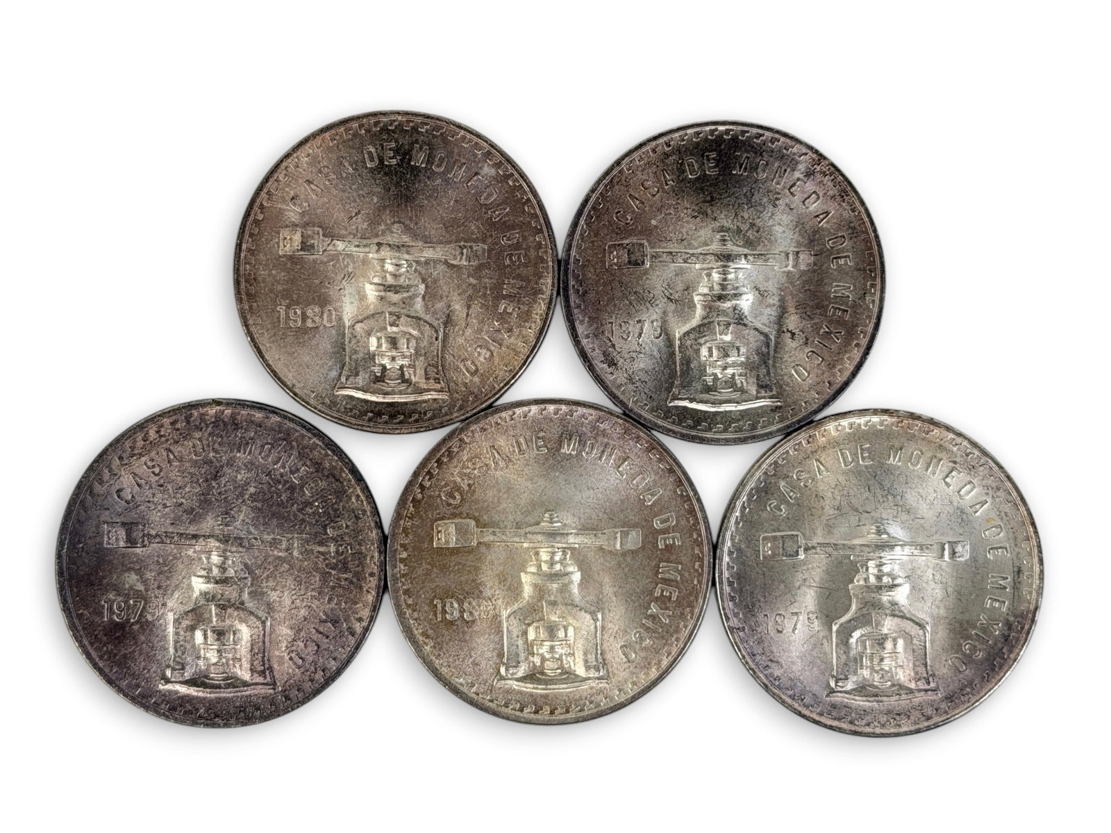 (5) Sterling Mexican Troy Ounce Silver Coins: All coins come in plastic sleeves. Condition: Various levels of tarnishing. See images for details. 