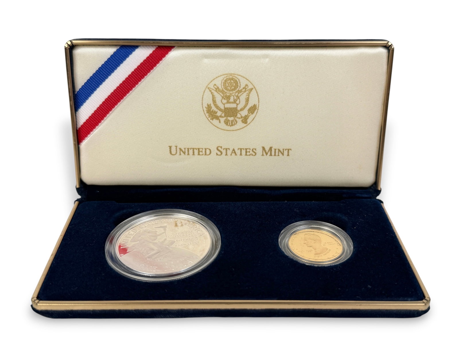 1996 Smithsonian Anniversary $5 Gold & $1 Silver Proof Set: The set includes a silver liberty dollar coin and a gold $5 coin. Condition: Original box included. Coins are in plastic cases. Please see images for details. 