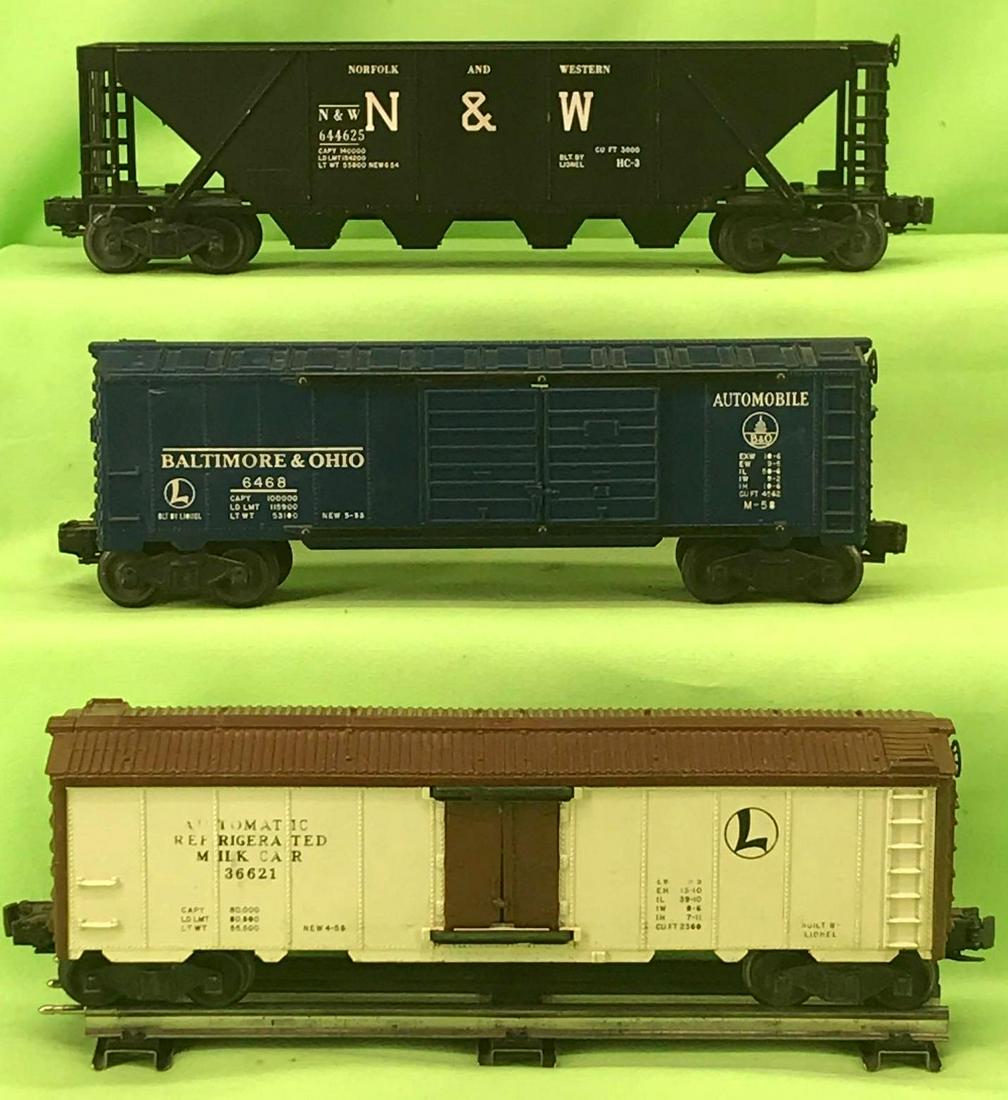 Lionel O gauge 6468 B&O automobile 3662 milk car: Postwar Lionel O gauge 6468 Baltimore and Ohio double door automobile car, 3662 milk car, and 6446-25 Norfolk and Western quad hopper with chip to edge of hopper, clean C6+.