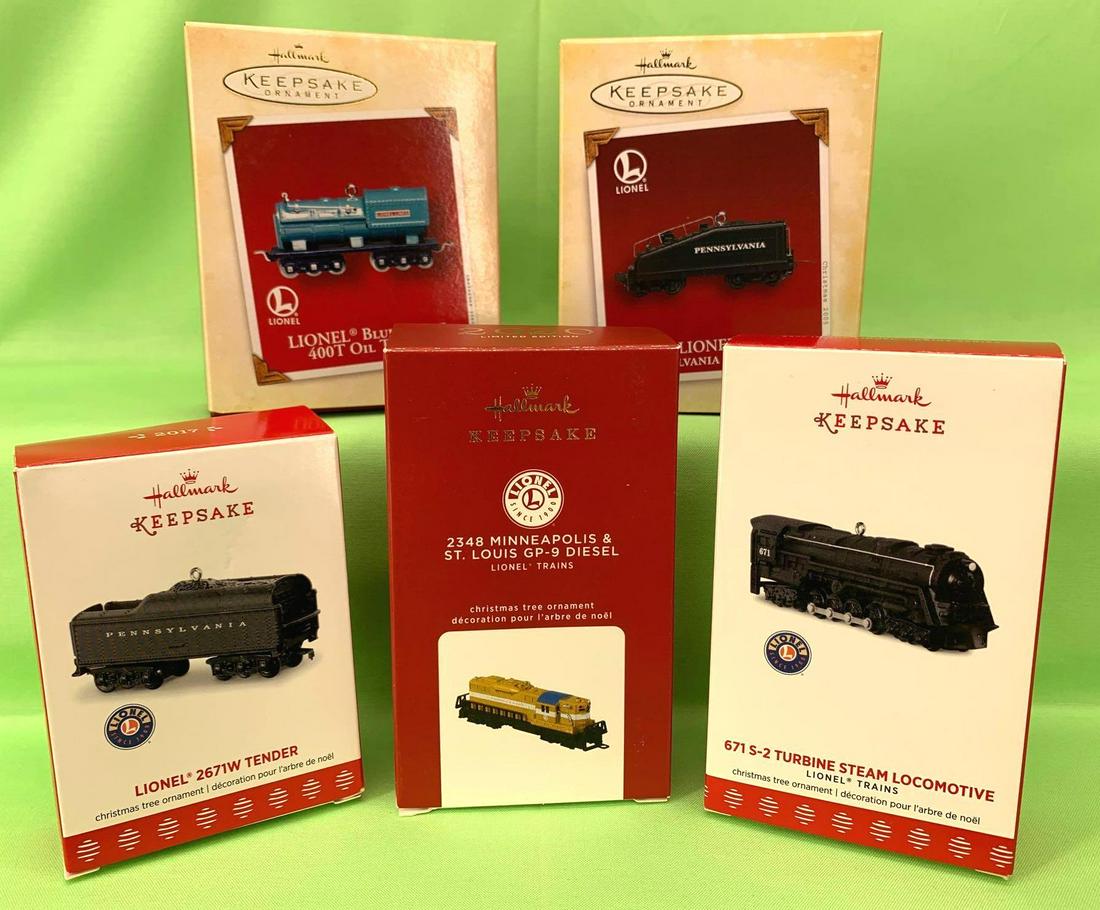 Hallmark Keepsake Ornaments Locomtives and Tenders new: Hallmark Keepsake Ornaments. All ornaments appear to be in like new if not new condition. Boxes have little to no wear. This lot includes, Lionel 2348 Minneapolis & St. Louis GP-9 Diesel 2020, Lio