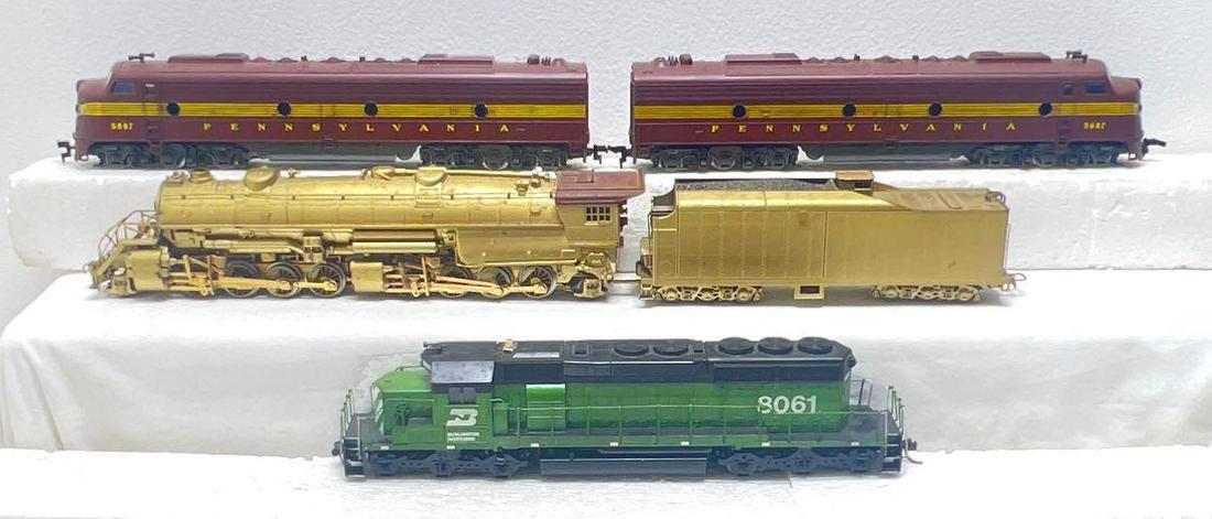 HO gauge Rivarossi 2-8-8-2 PRR 5887 EMD E8 diesel: HO gauge Rivarossi 2-8-8-2 steam locomotive and tender, PRR 5887 EMD E8 diesel locomotive A units, and 8061 Burlington diesel locomotive unit. Trains may or may not be missing minor trim or parts. Ple
