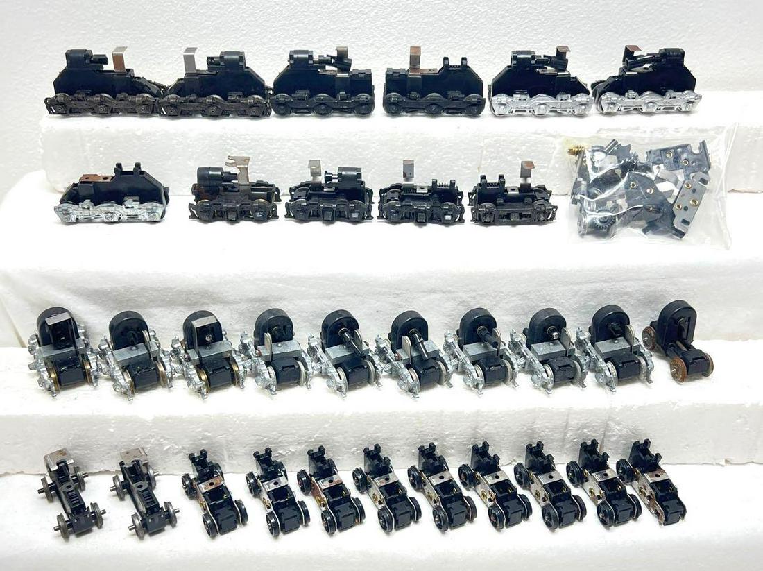 HO gauge diesel locomotive powered truck assemblies and: HO gauge diesel locomotive powered truck assemblies and parts, all are unmarked. Nice lot for the operator or a repair shop. Please view our photos very carefully as these trains are being sold as the
