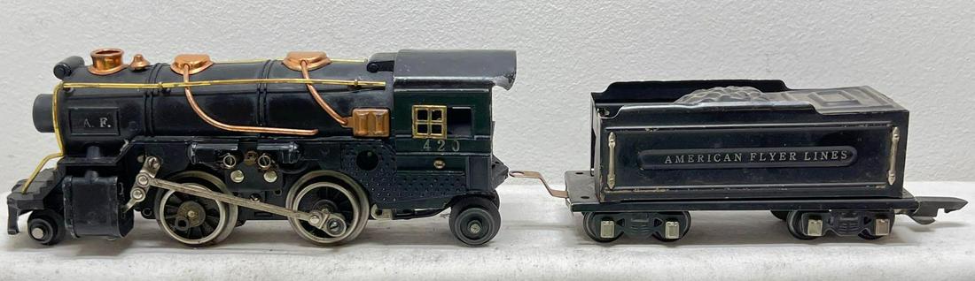 Prewar American Flyer narrow gauge 420 steam locomotive: Prewar American Flyer narrow gauge 420 steam locomotive and tinplate tender with coal pile and rubber stamp lettering. Loco has a dinged cab corner and missing linkage on both sides. Tender is nice C6