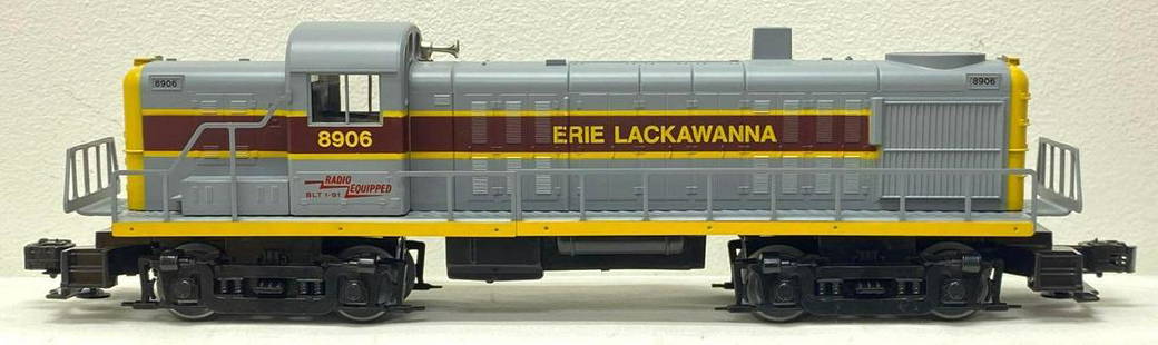 Modern Era Lionel O gauge 18906 Erie Lackawanna RS-3 diesel in original box: Modern Era Lionel O gauge 18906 Erie Lackawanna RS-3 diesel engine in original box. Cracked fuel tank/switch housing. Train looks C8. Boxs show little wear, dinged corner, square and solid.