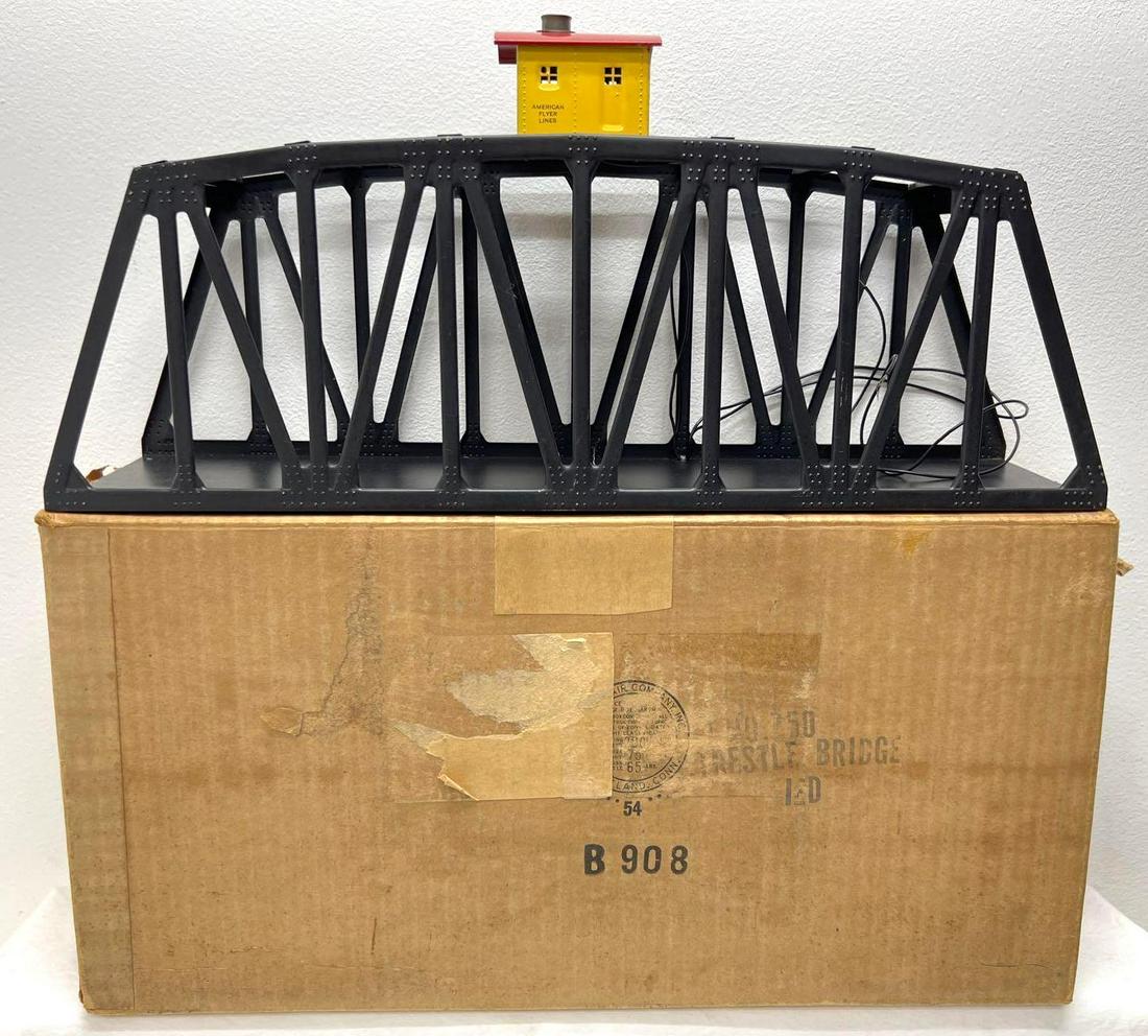 Postwar American Flyer S Gauge 750 trestle bridge in original box: Postwar American Flyer S Gauge 750 trestle bridge with illuminated shack in original box, C7. Box has older tape, spots of tape removal, hand written identifications. Box is very square and very solid