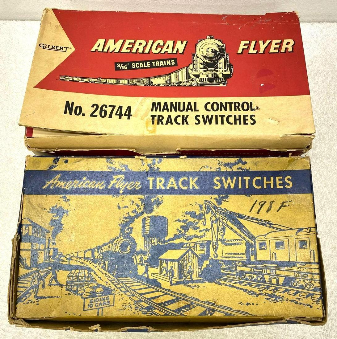 Postwar American Flyer S Gauge 722A and 26744 switches in original boxes: Postwar American Flyer S Gauge 722A manual control and 26744 manual control, switches in original boxes. Boxes have tears around openings and flaps. One pair of switches have some surface rust, other 