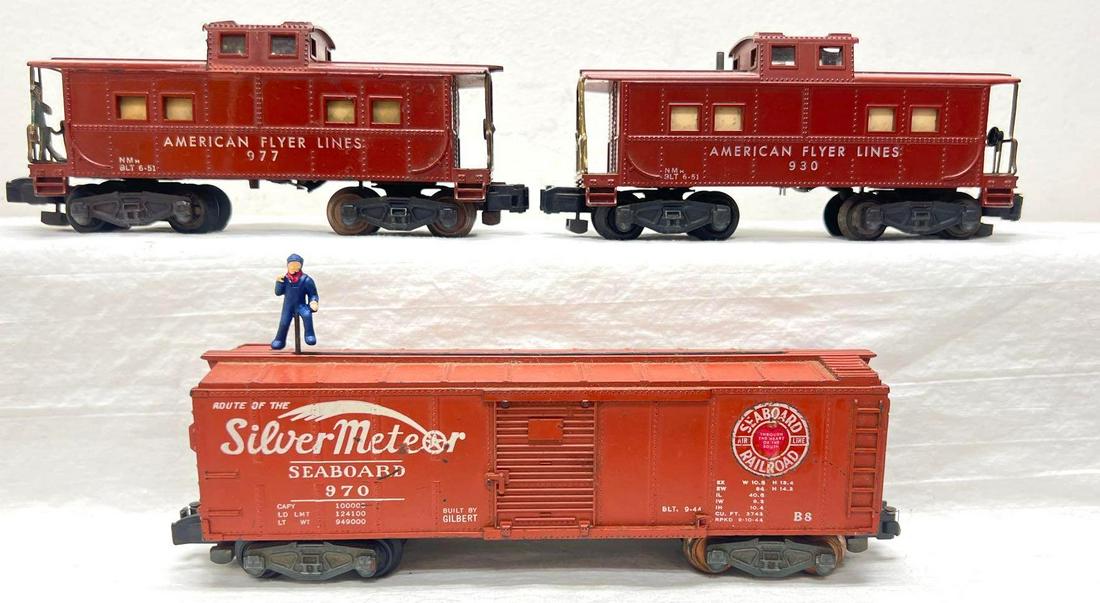Postwar American Flyer S Gauge 930 970 977: Postwar American Flyer S Gauge 930 illuminated caboose (missing a catwalk end), 970 Seaboard walking brakeman house car (tiny melt marks in an upper corner of a side), 977 illuminated caboose with bra
