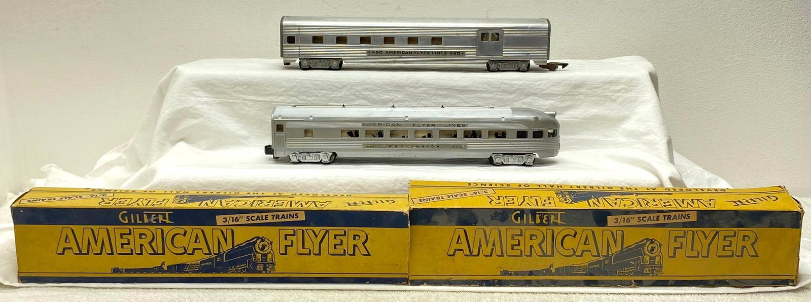 Postwar American Flyer S Gauge 660 963 in original boxes: Postwar American Flyer S Gauge 660 aluminum combine car with heavy oxidation/rust on frame, 963 Washington observartion with cracked and missing drumhead in original boxes. Boxes have missing flaps. P